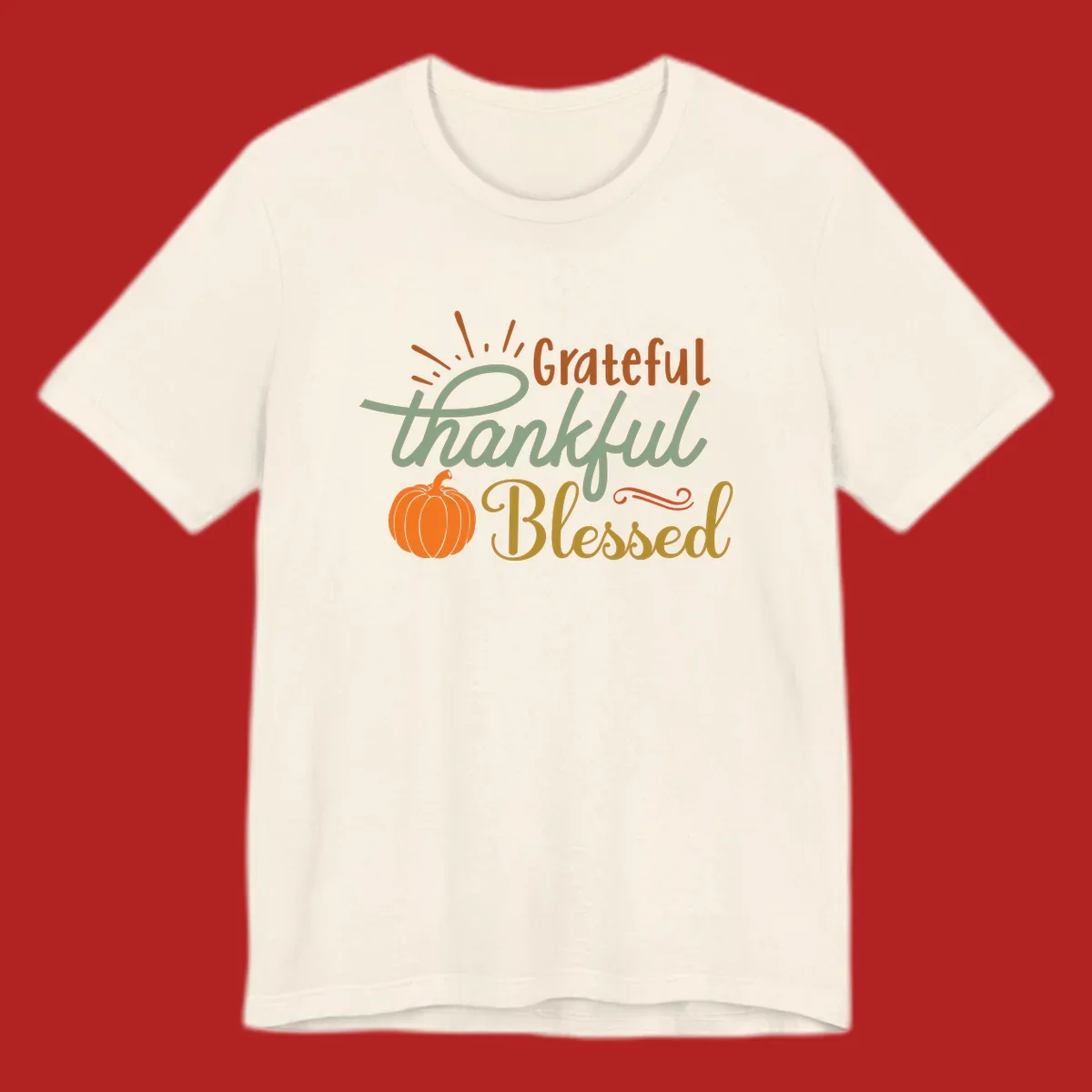 Grateful thankful blessed text with pumpkin and sun rays, autumn holiday design.