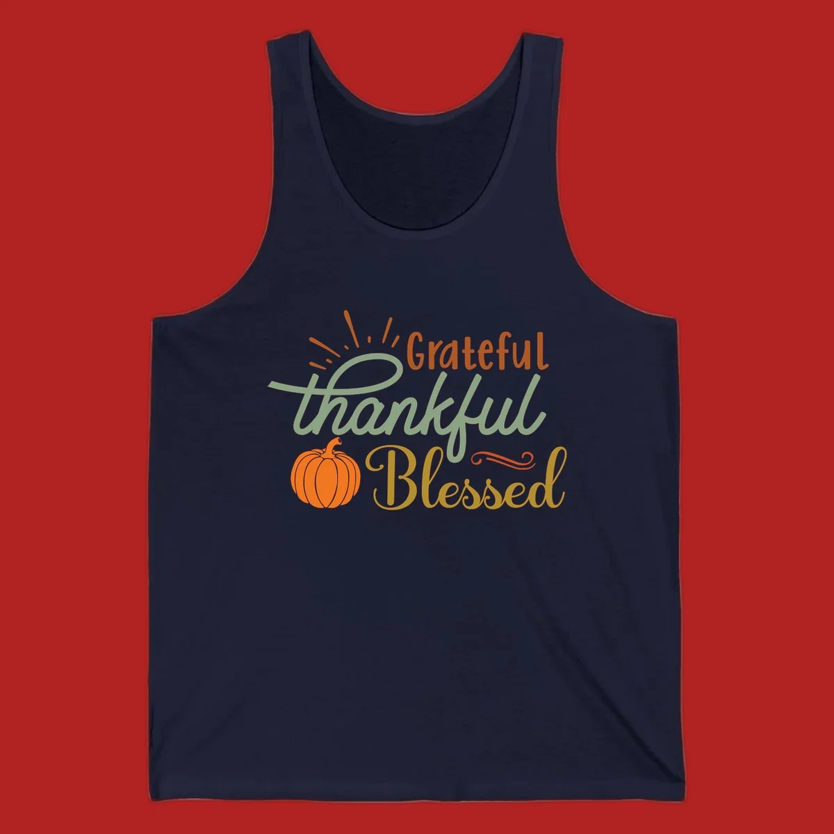 Grateful thankful blessed text with pumpkin and sun rays, autumn holiday design.