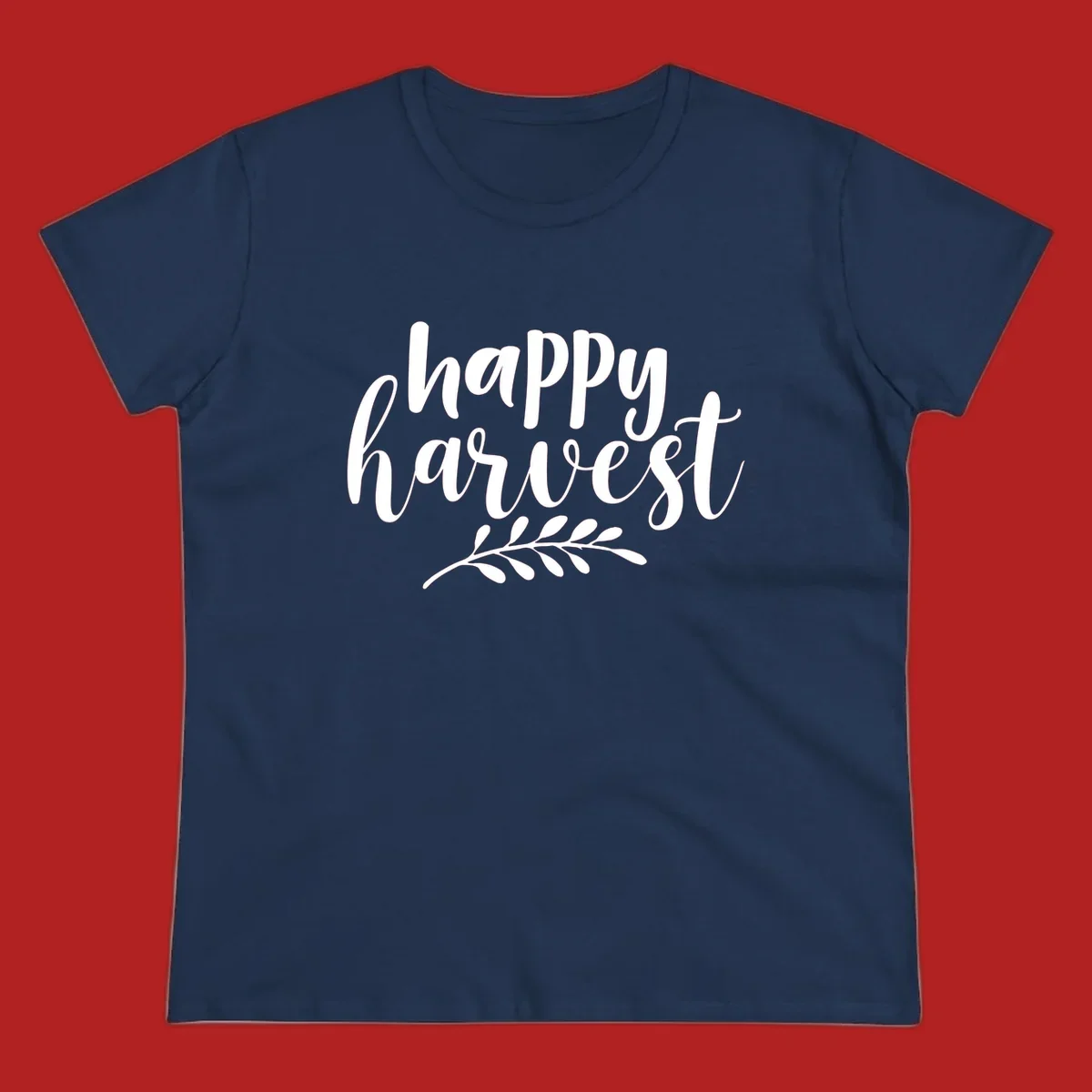 Happy harvest script text with a leaf sprig, suitable for fall and Thanksgiving.