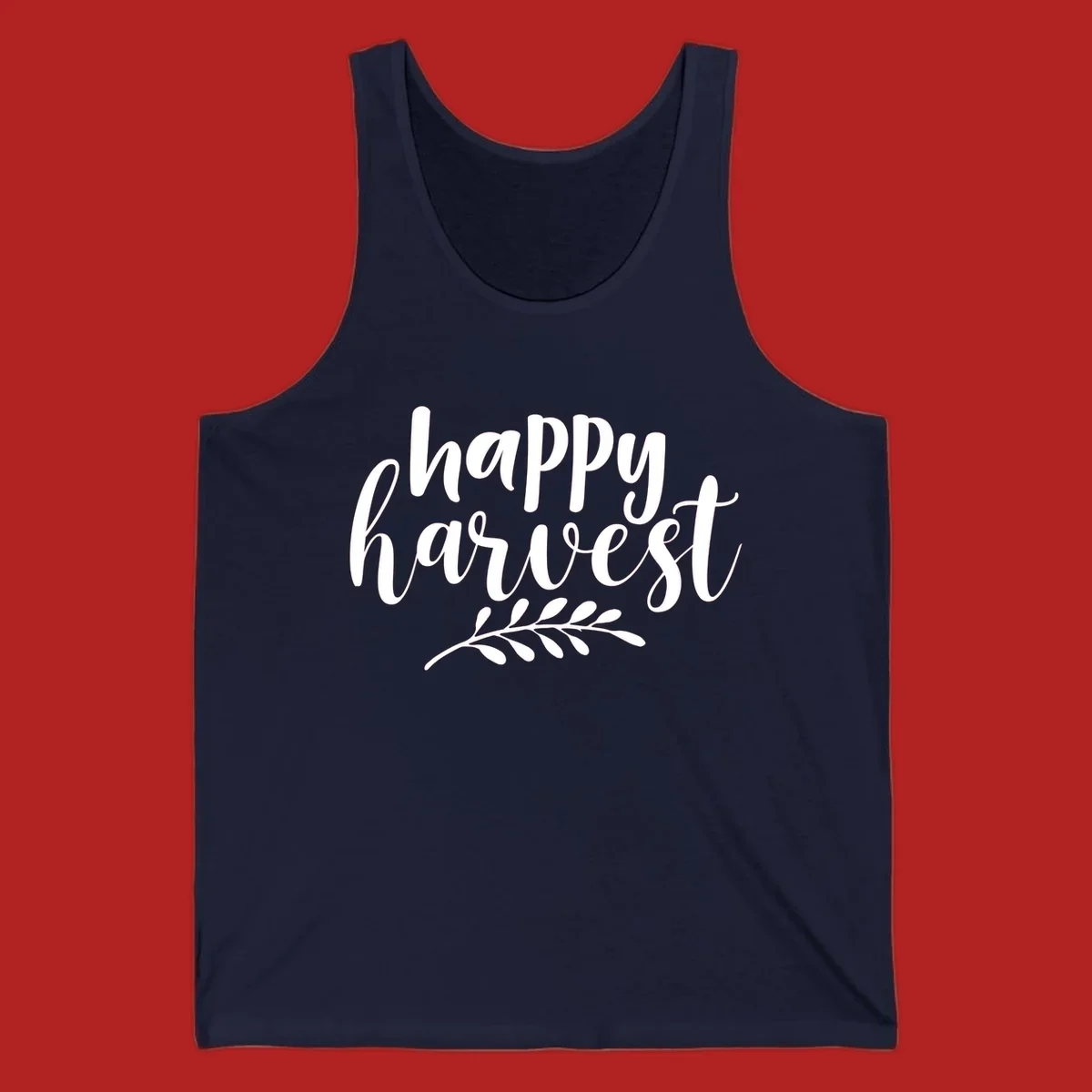 Happy harvest script text with a leaf sprig, suitable for fall and Thanksgiving.