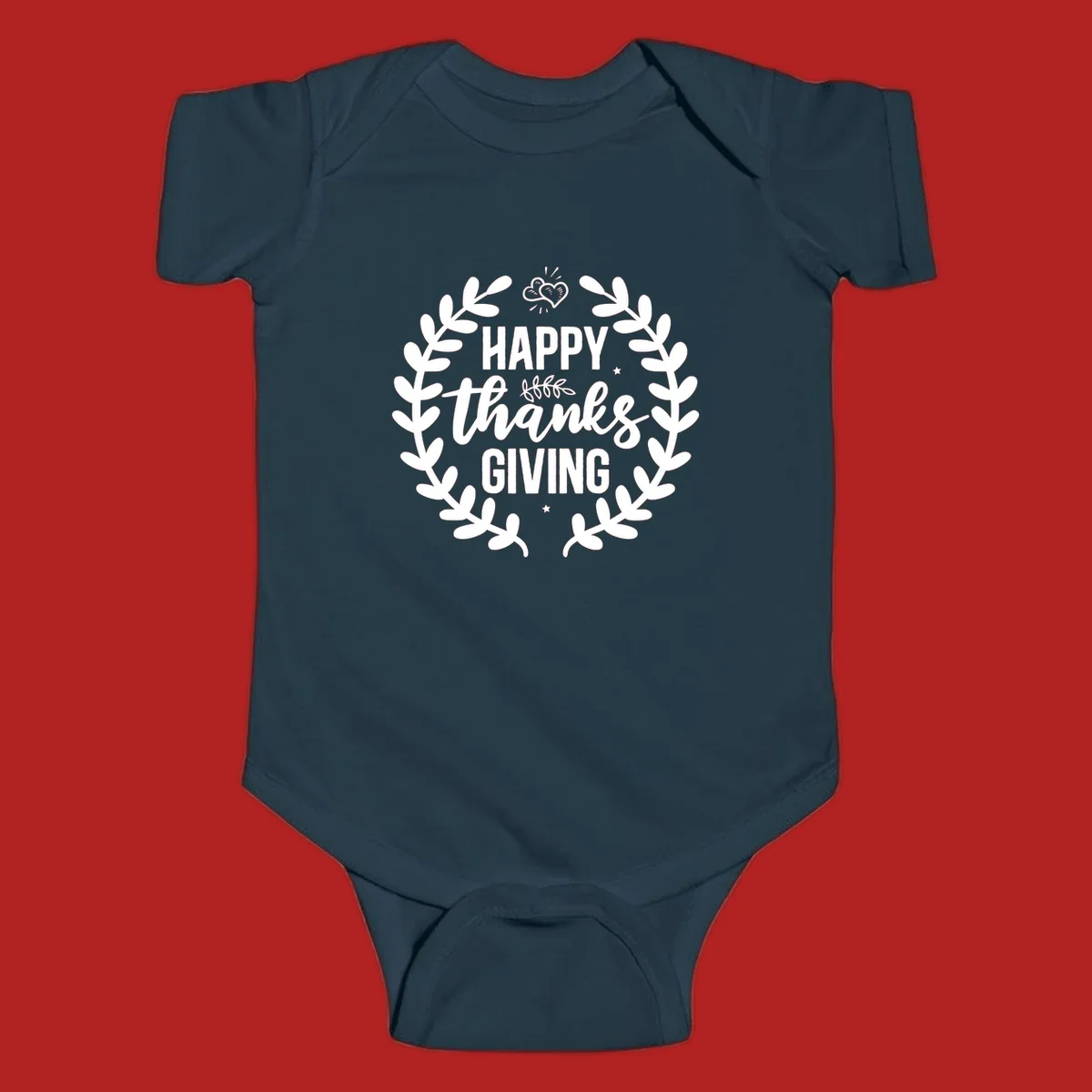 Happy Thanksgiving lettering inside a laurel wreath with hearts and stars.