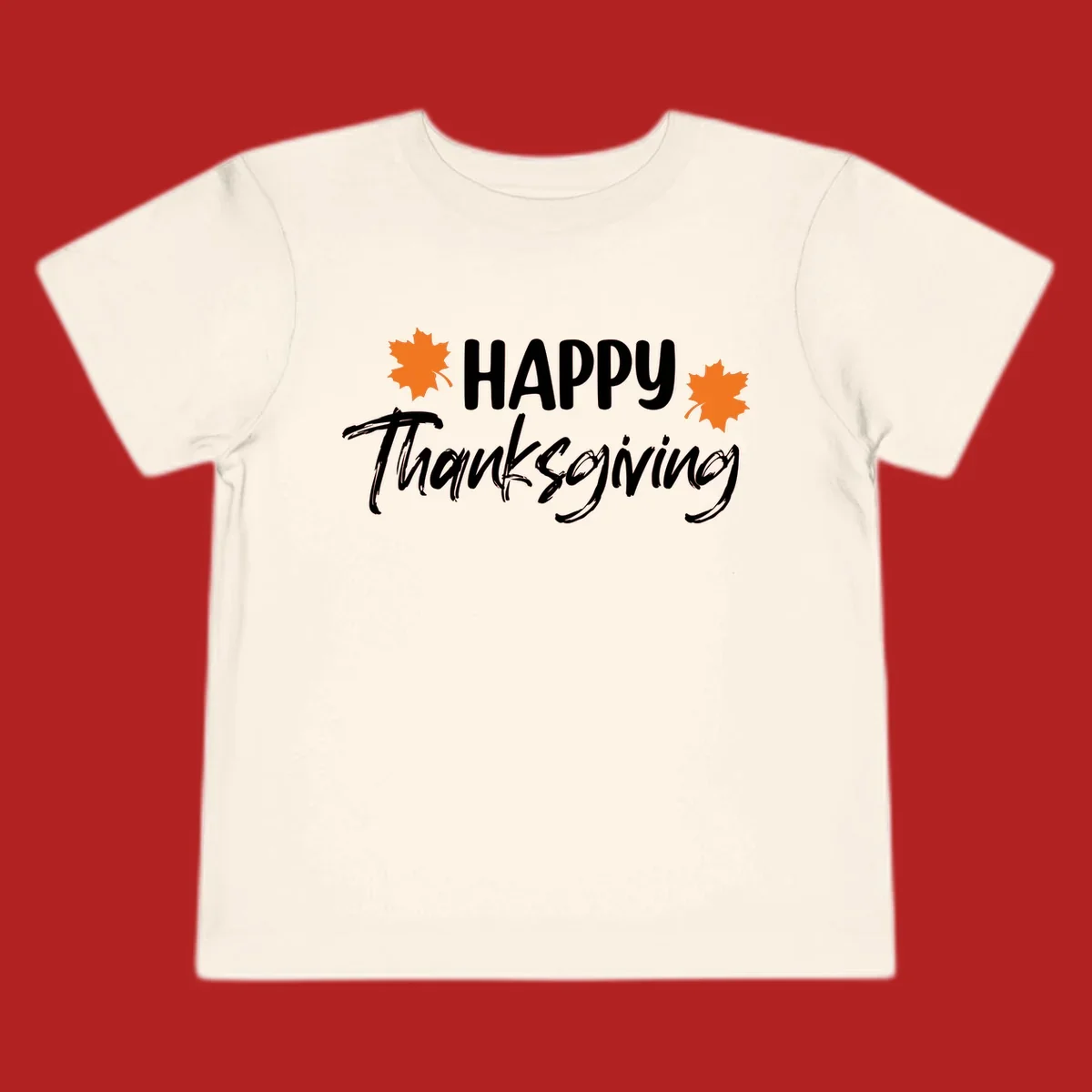 Happy Thanksgiving text with orange maple leaves, holiday design.