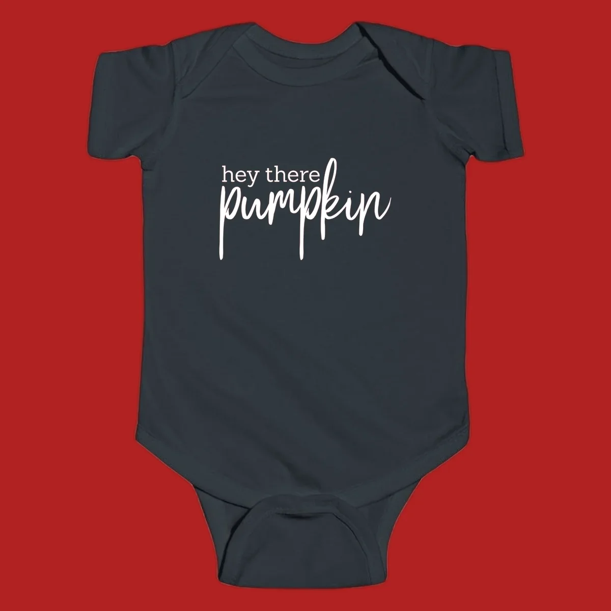 White text design with "hey there" in block font and "pumpkin" in script font, on a black background.