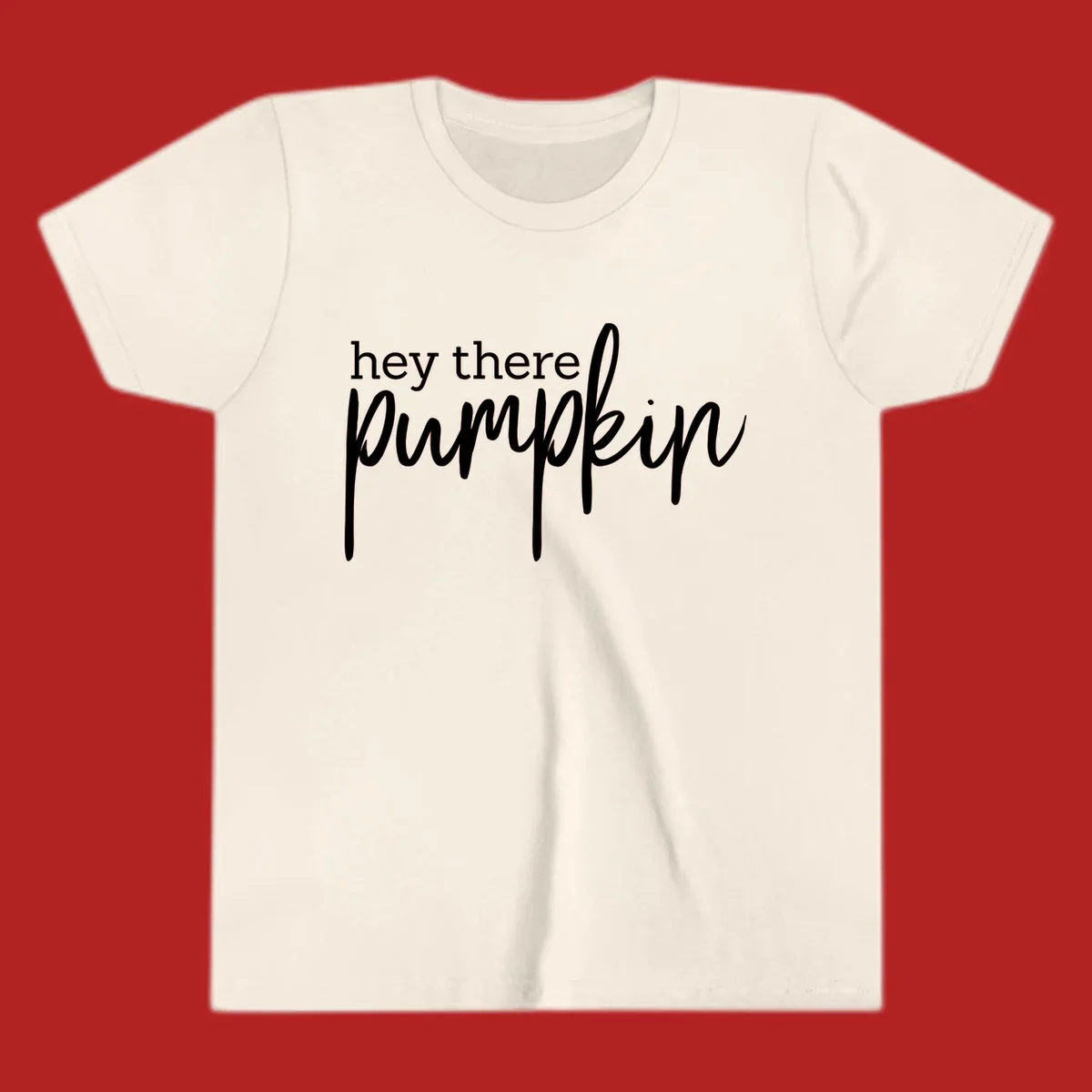 White text design with "hey there" in block font and "pumpkin" in script font, on a black background.