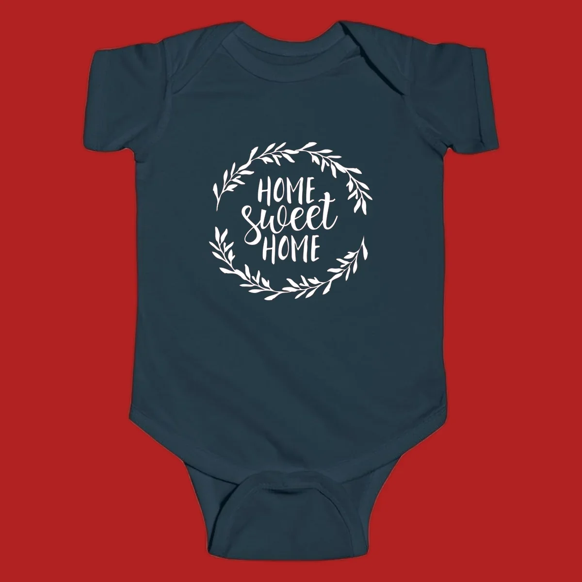 White 'Home Sweet Home' text with a floral wreath on a dark background.
