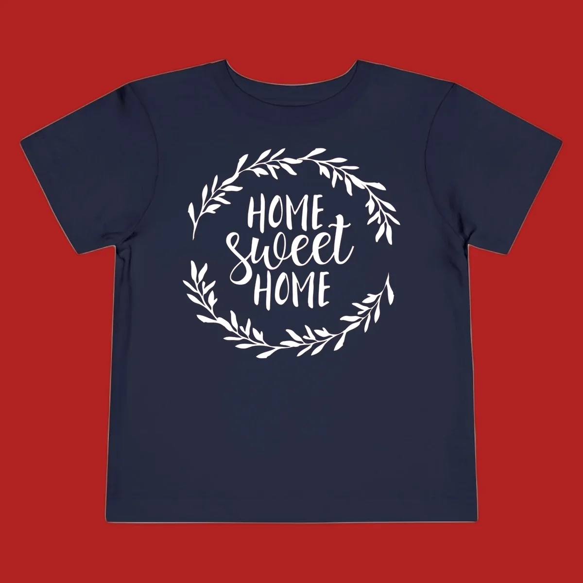 White 'Home Sweet Home' text with a floral wreath on a dark background.