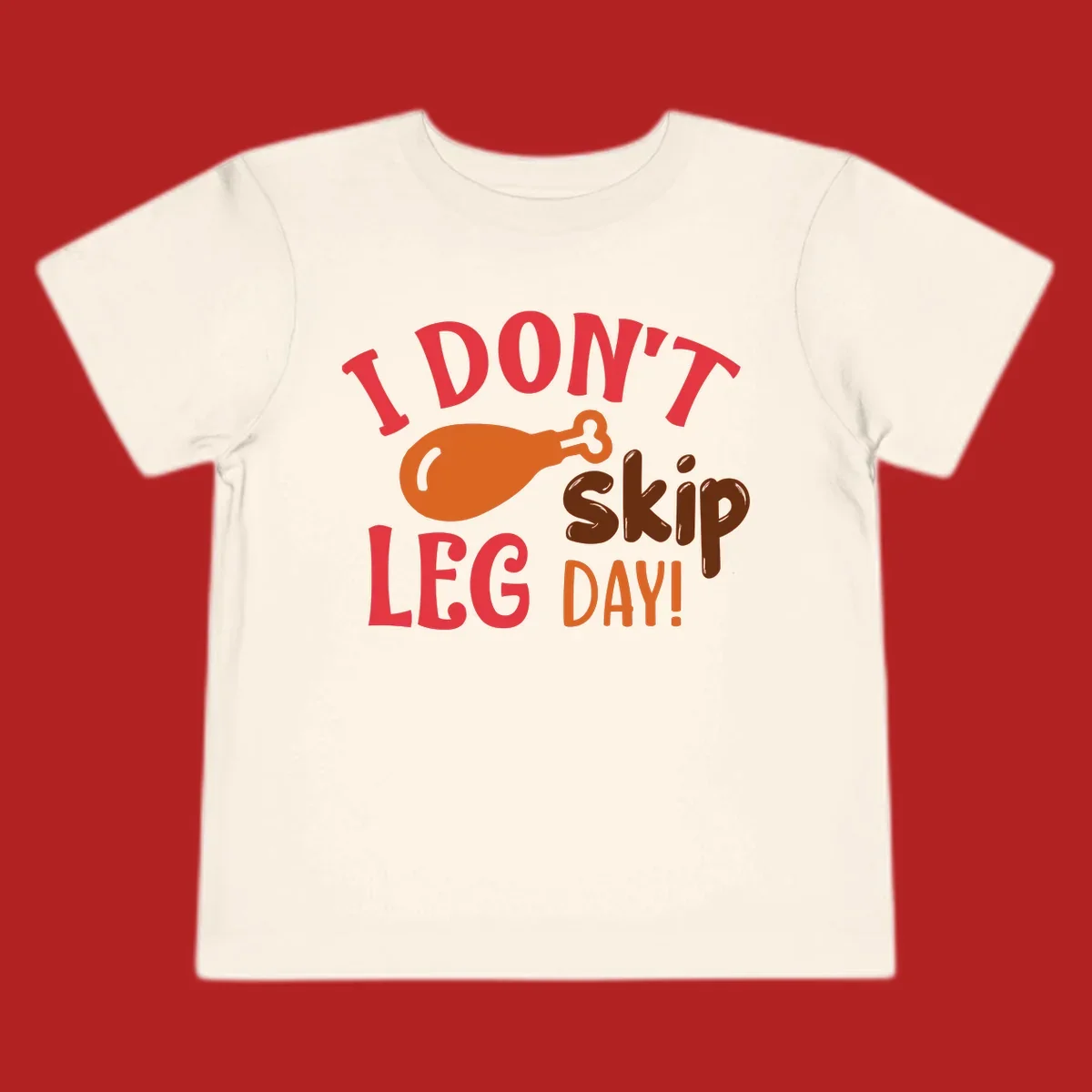 I Don't Skip Leg Day turkey drumstick graphic tee shirt with text.