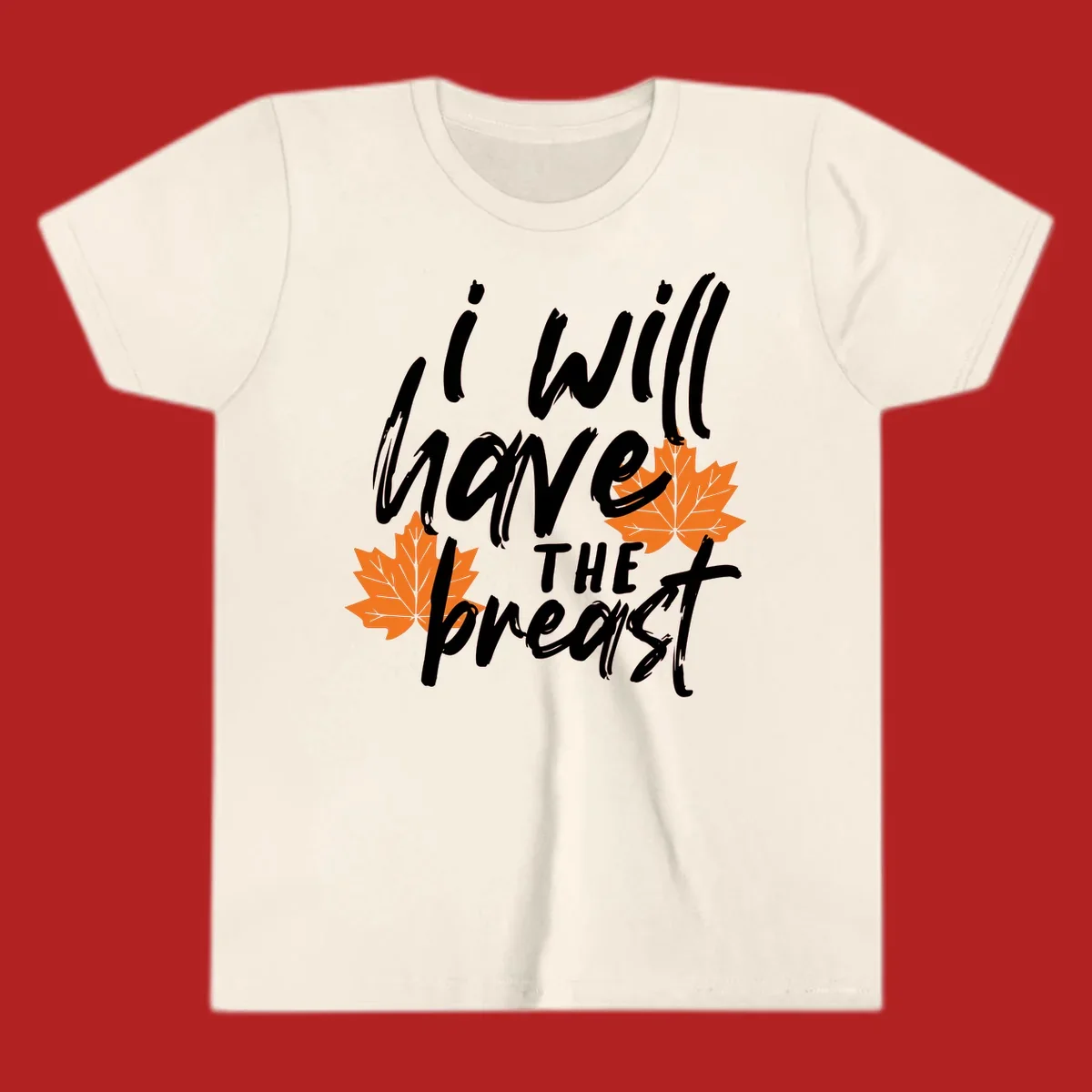 Thanksgiving pun design with text "i will have THE breast" and orange maple leaves.