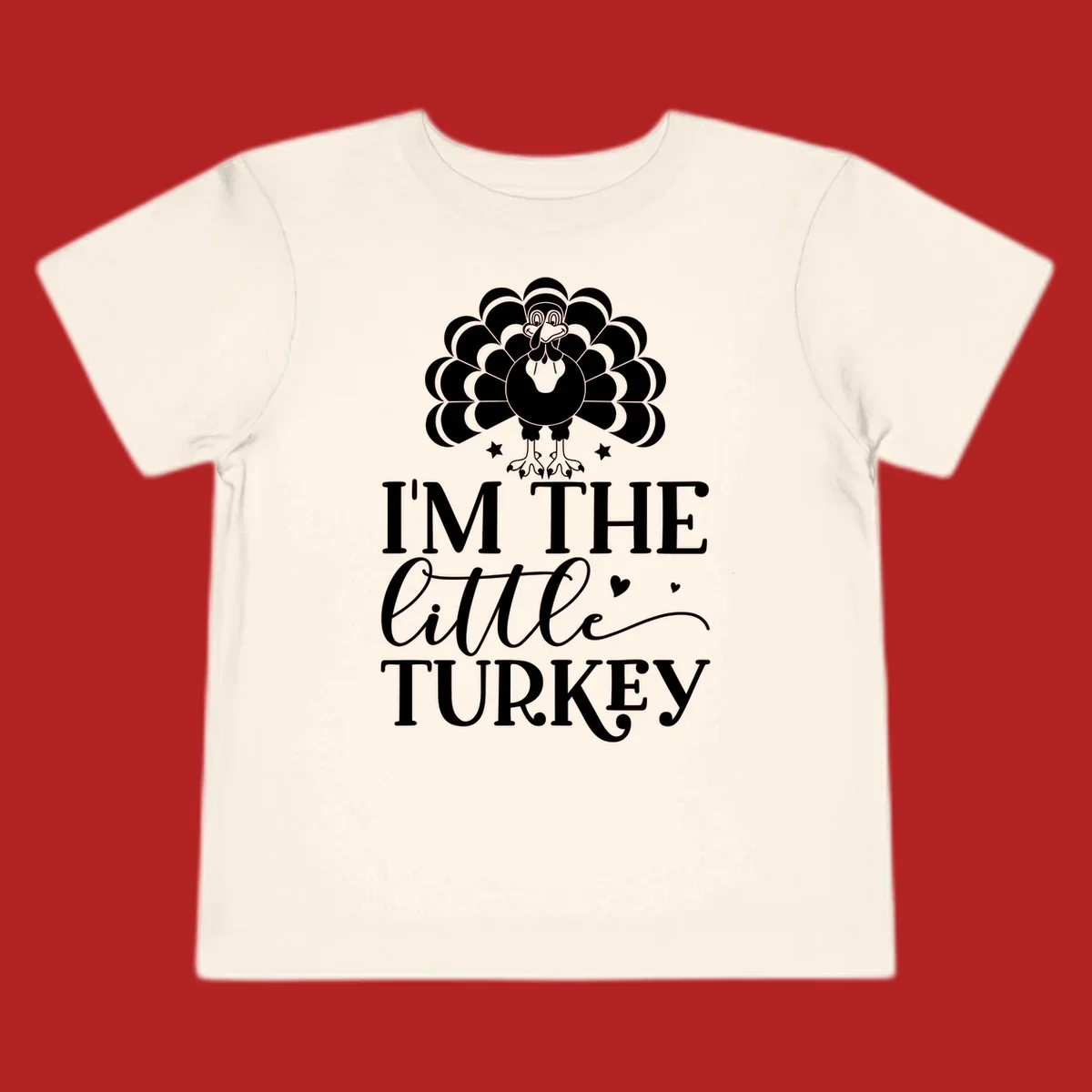 Illustration of a turkey with text 'I'M THE Little TURKEY', for Thanksgiving.