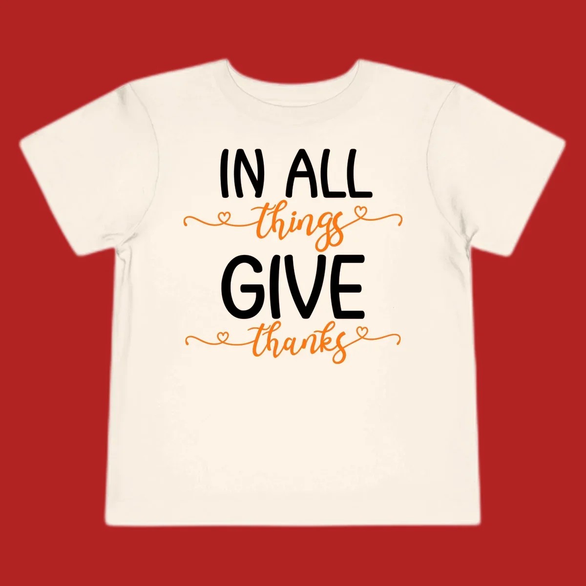 In all things give thanks phrase with script font and heart accents.