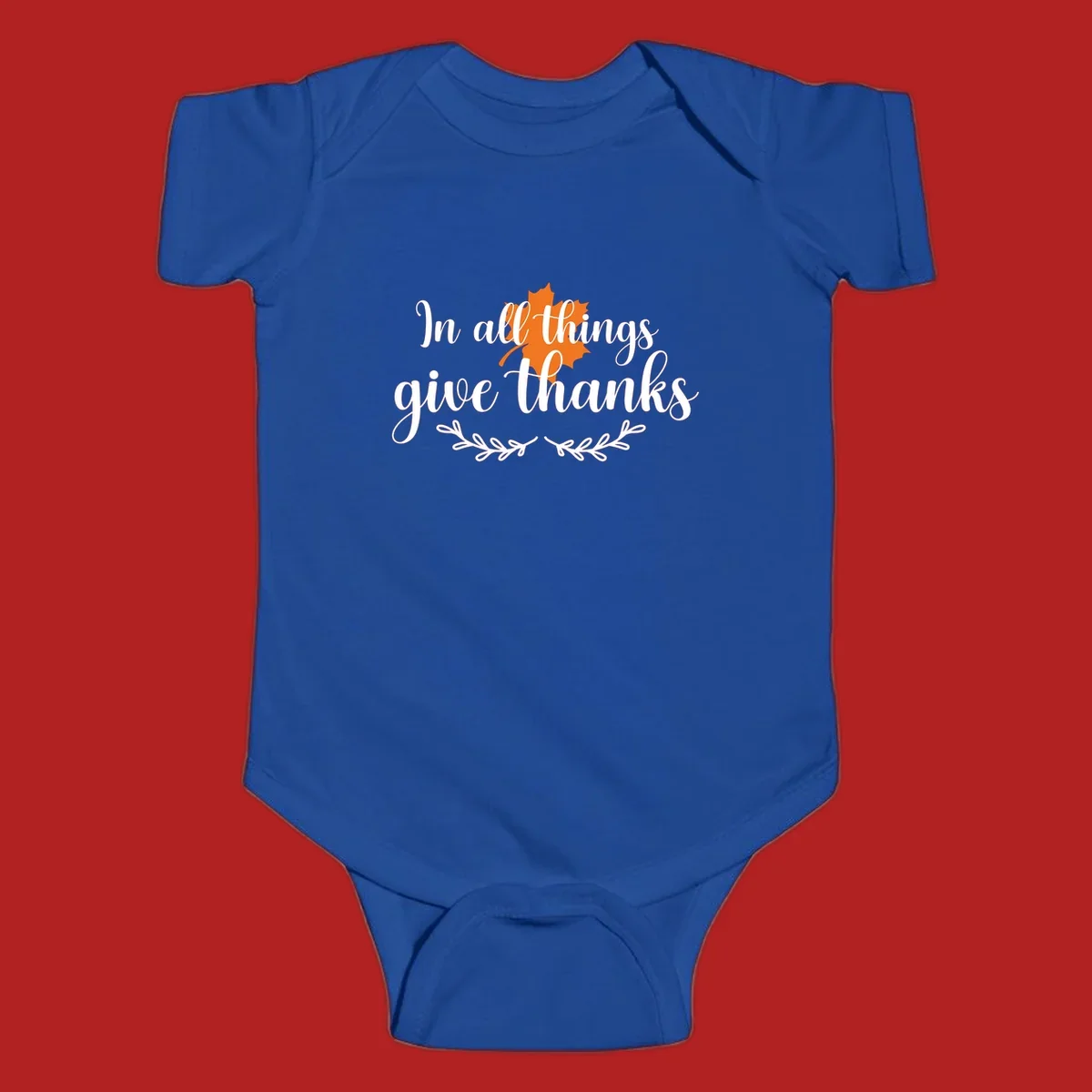 Thanksgiving typography with orange maple leaf and 'In all things give thanks' text.