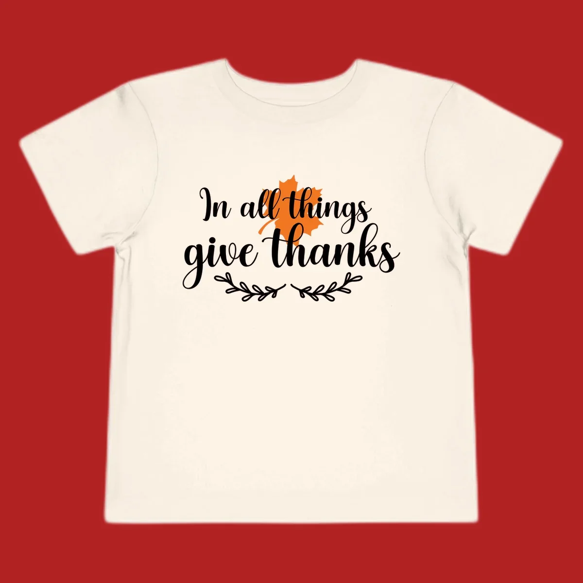 Thanksgiving typography with orange maple leaf and 'In all things give thanks' text.