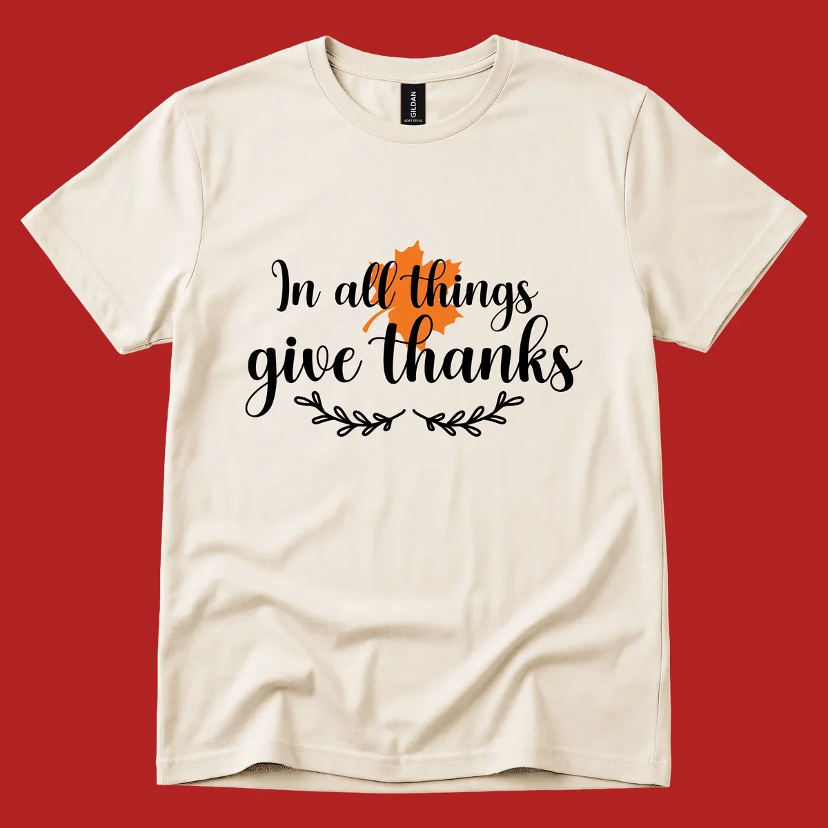 Thanksgiving typography with orange maple leaf and 'In all things give thanks' text.
