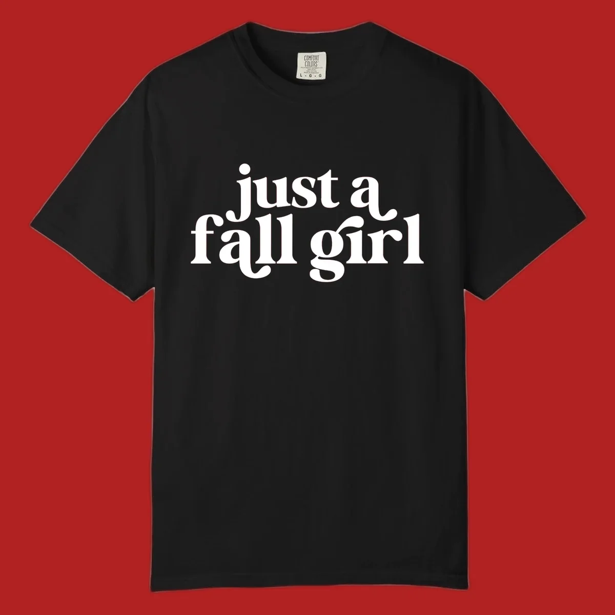 Just a Fall Girl typography design in white.