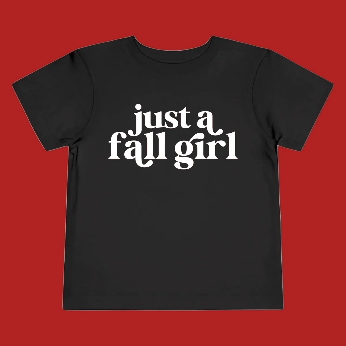 Just a Fall Girl typography design in white.