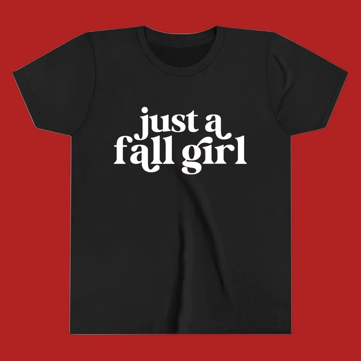 Just a Fall Girl typography design in white.