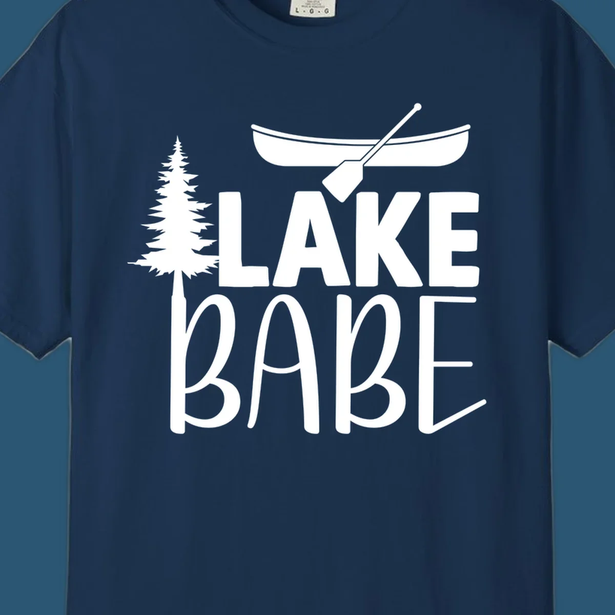 Lake Babe design with canoe, pine tree, and text. Lake-babe-style graphic.