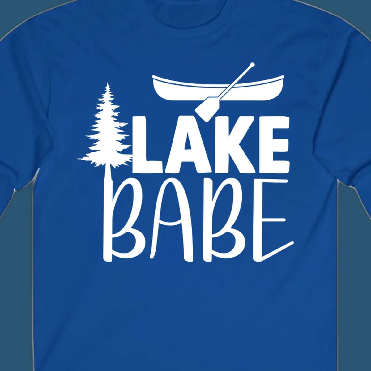 Lake Babe design with canoe, pine tree, and text. Lake-babe-style graphic.