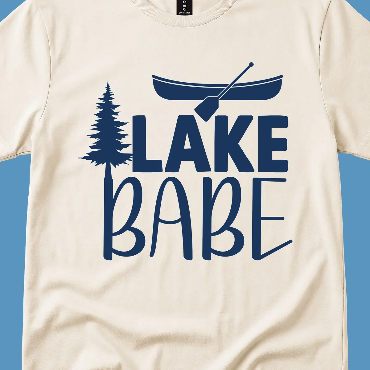 Lake Babe design with canoe, pine tree, and text. Lake-babe-style graphic.