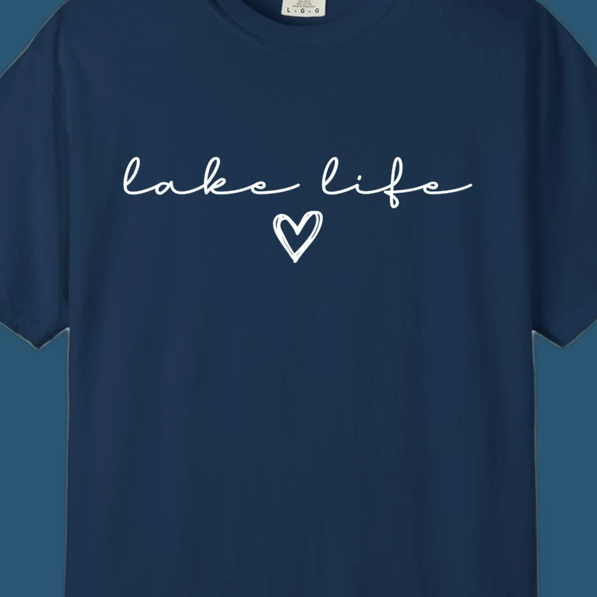 Lake life text with a heart graphic, in white and navy.