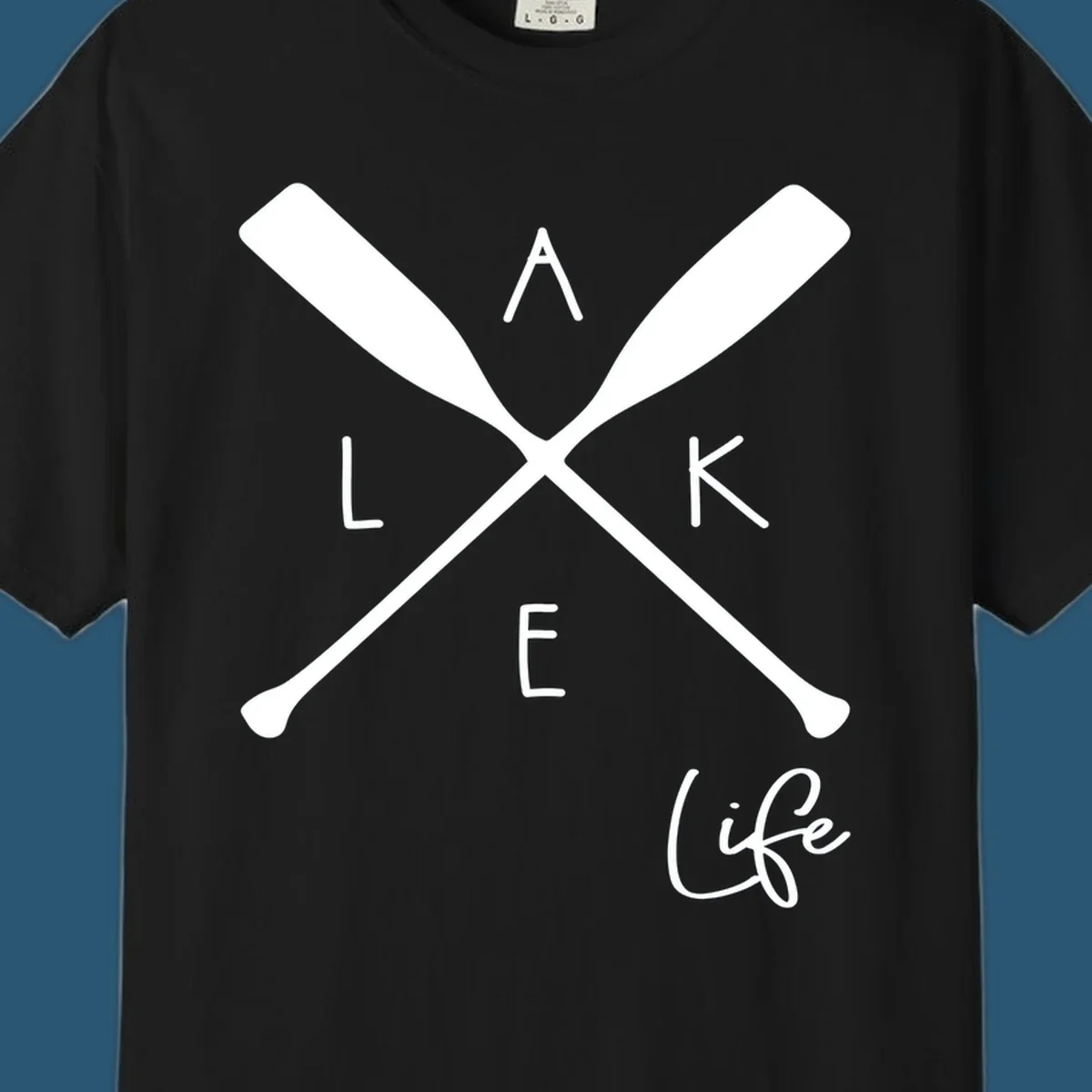 Lake life design with crossed oars and text.
