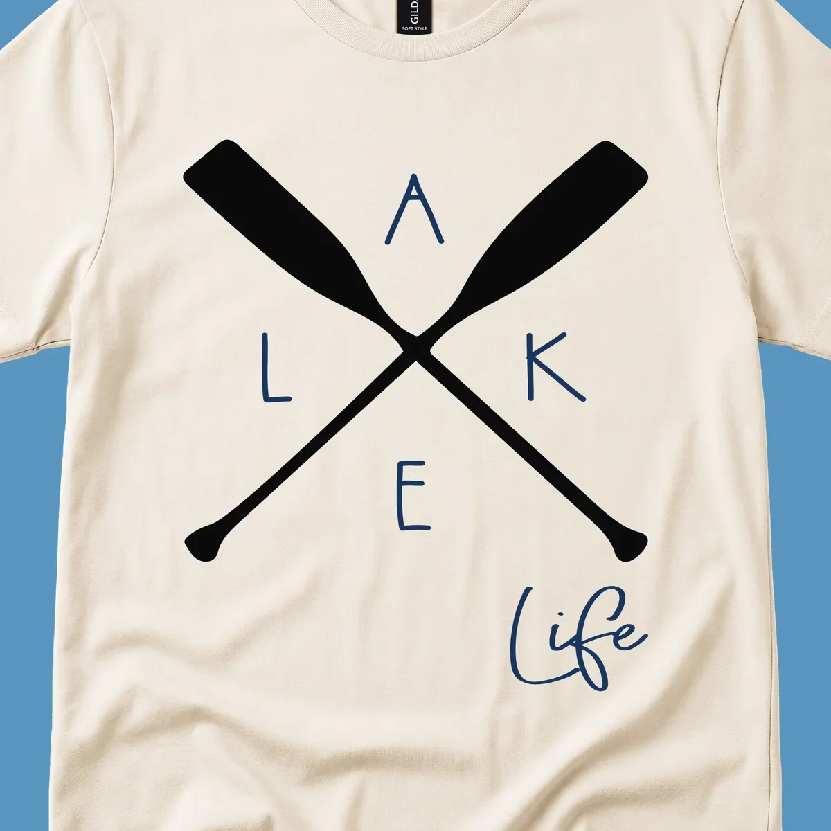 Lake life design with crossed oars and text.