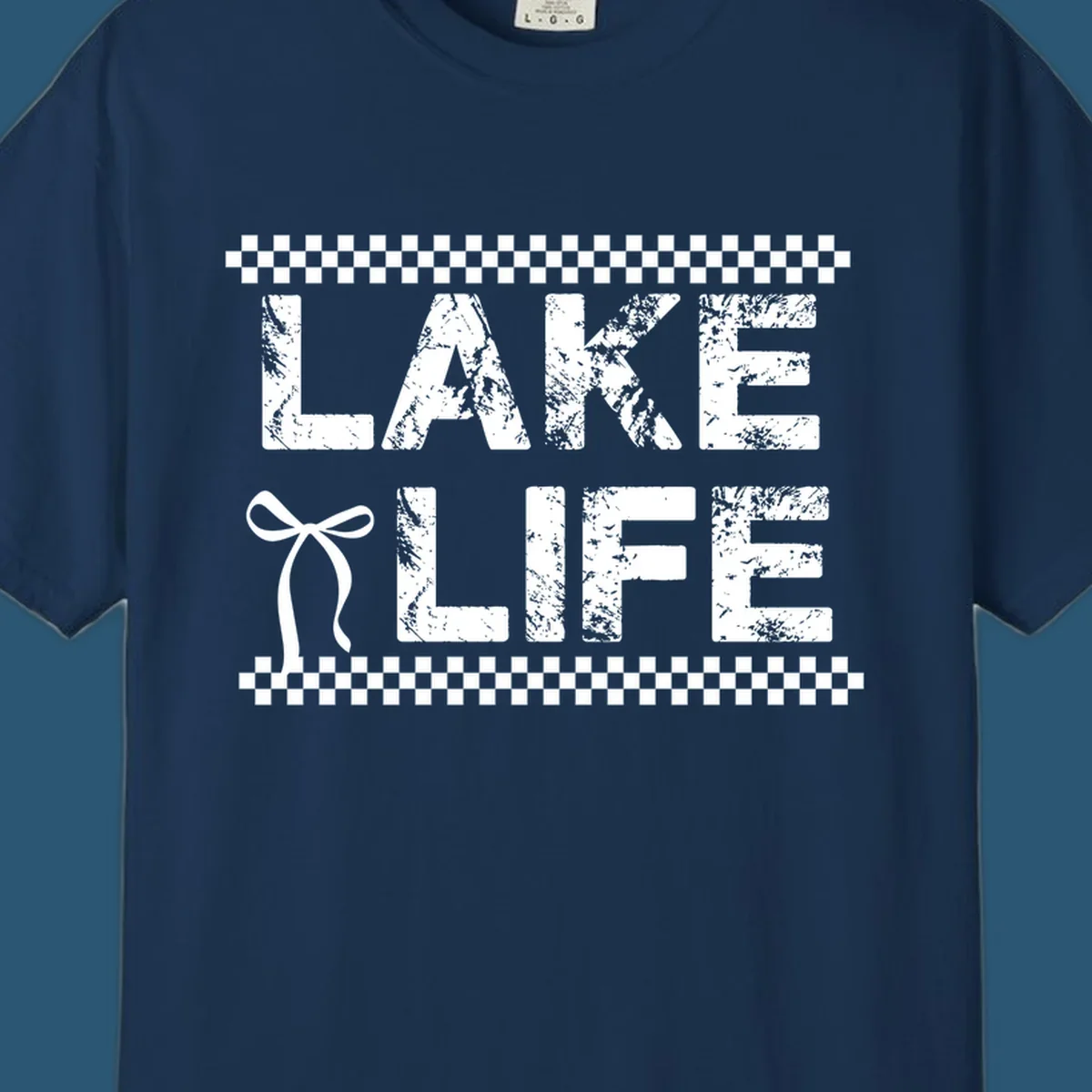 Lake Life text with bow accent and checkerboard border, distressed font.