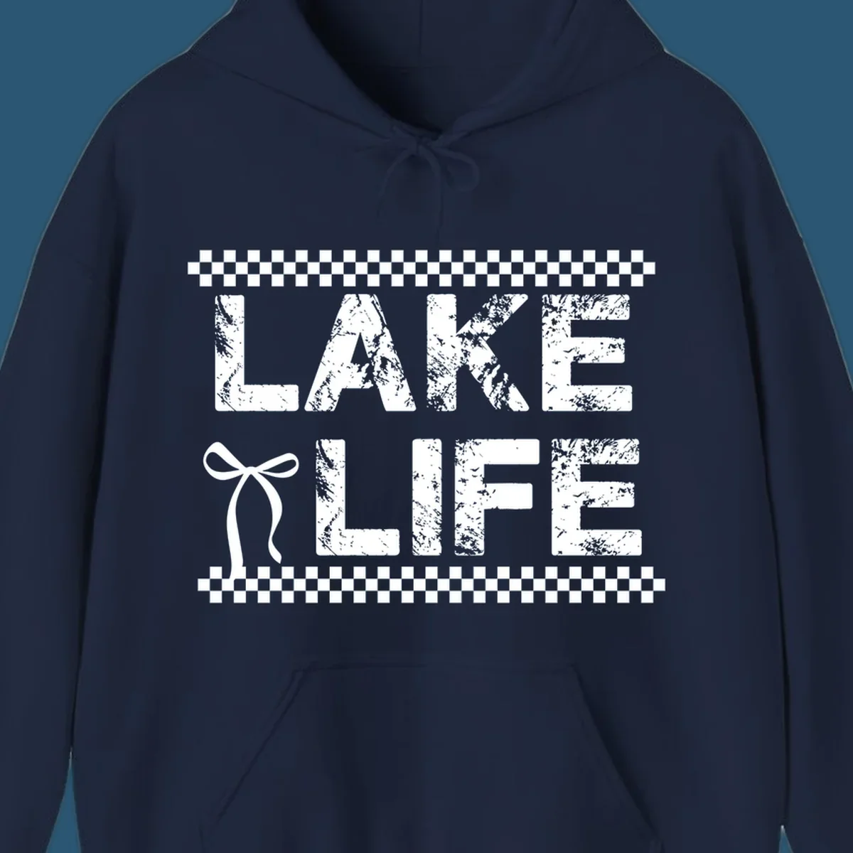 Lake Life text with bow accent and checkerboard border, distressed font.