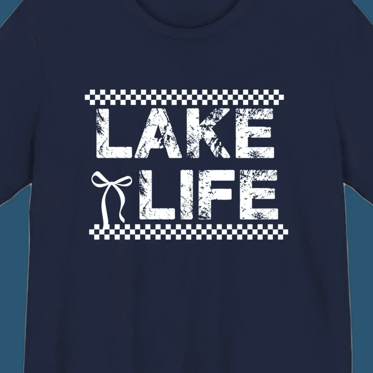 Lake Life text with bow accent and checkerboard border, distressed font.