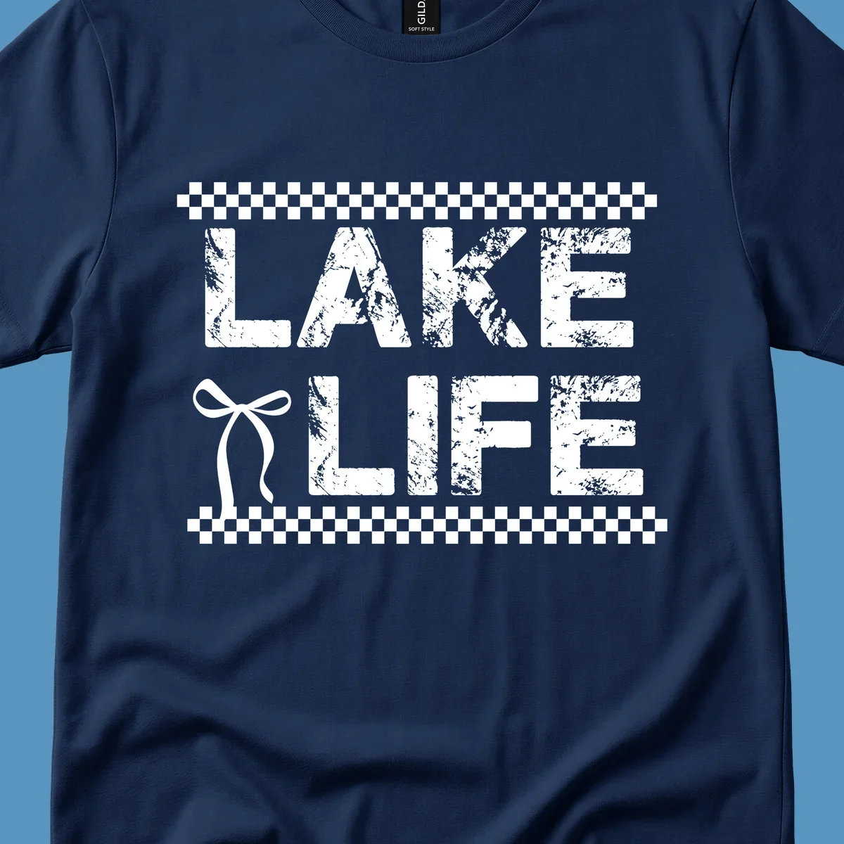 Lake Life text with bow accent and checkerboard border, distressed font.