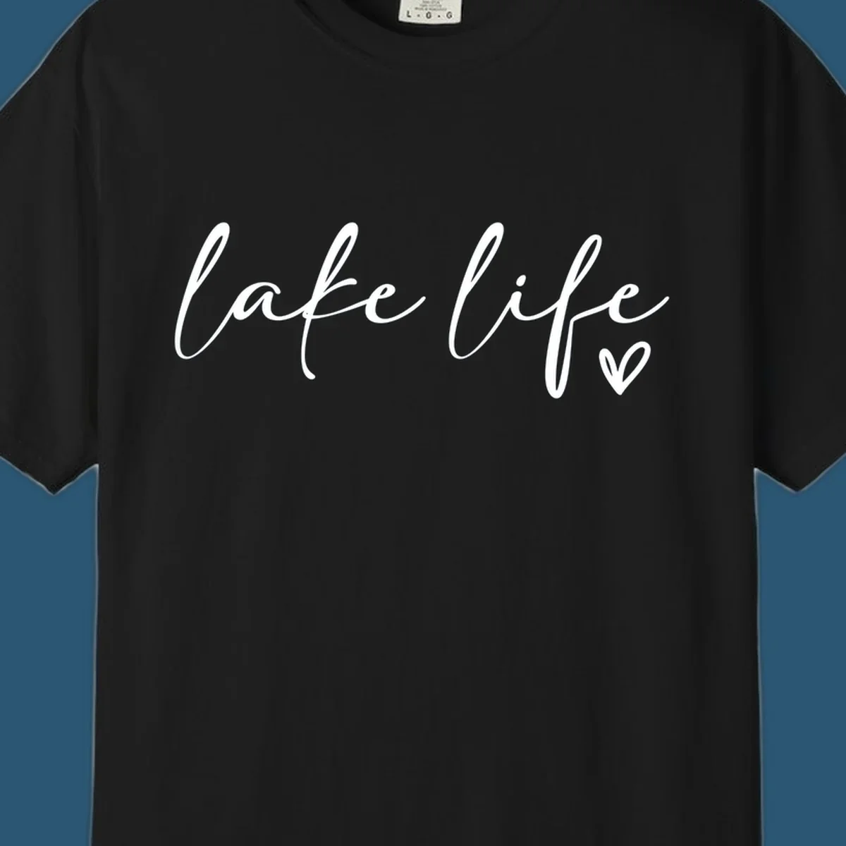 White script text reading 'lake life' with a small heart icon, on a black background.