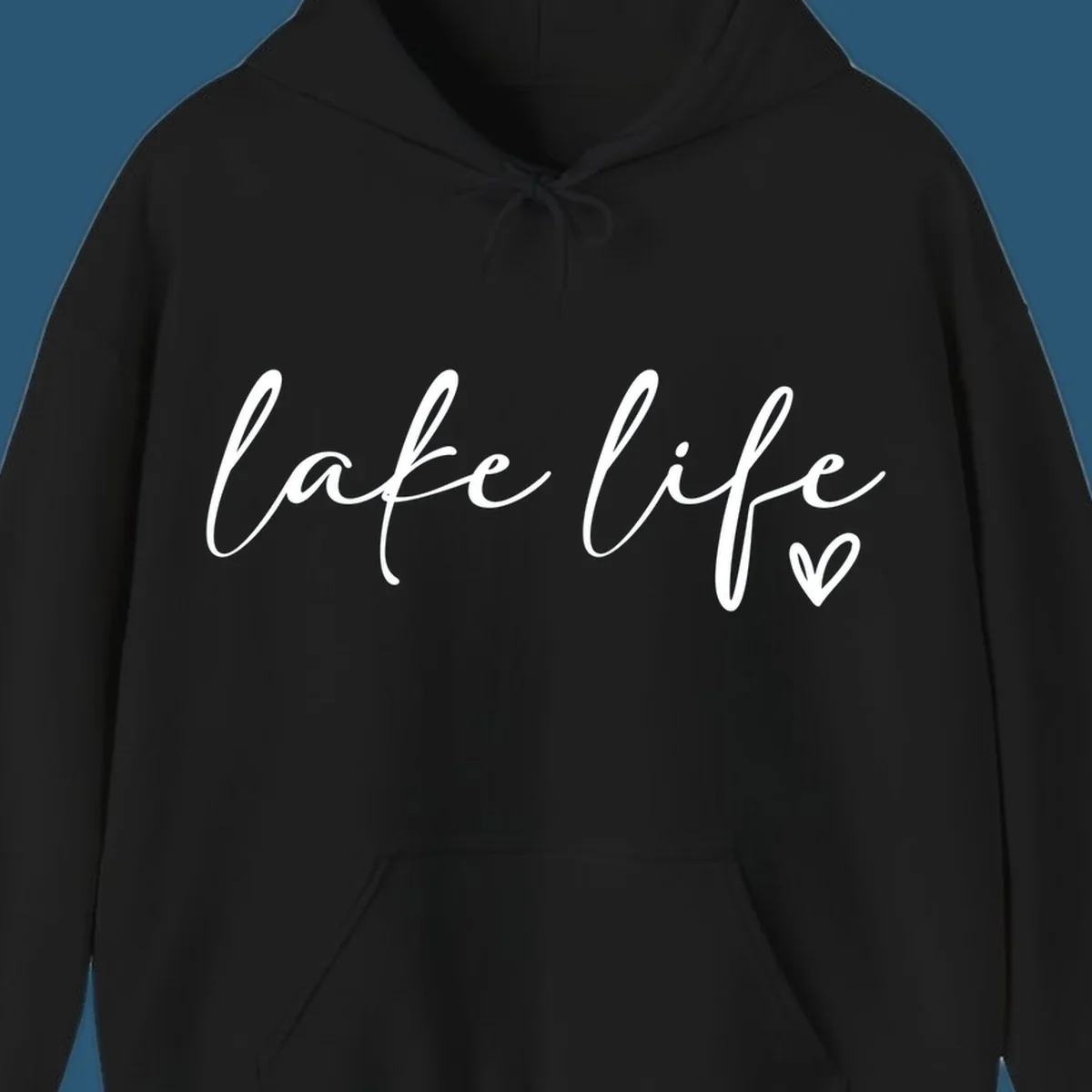 White script text reading 'lake life' with a small heart icon, on a black background.