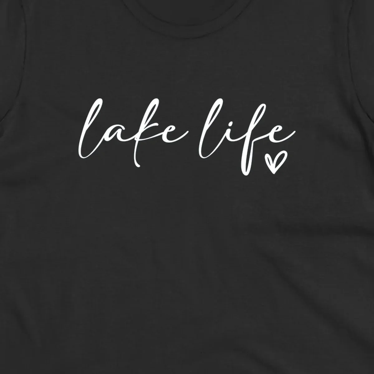 White script text reading 'lake life' with a small heart icon, on a black background.