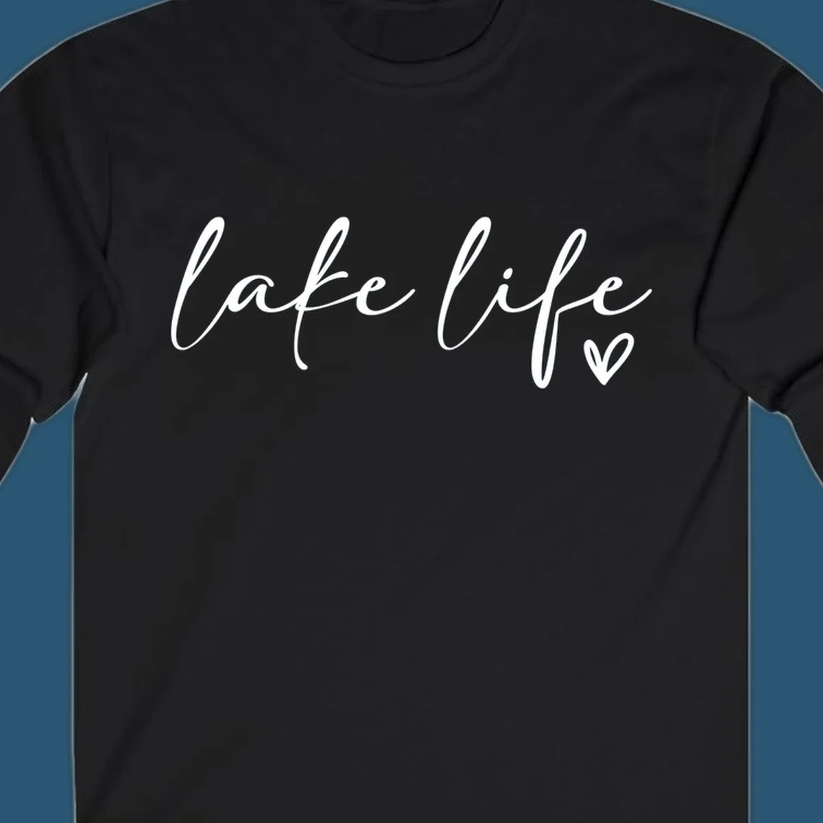 White script text reading 'lake life' with a small heart icon, on a black background.