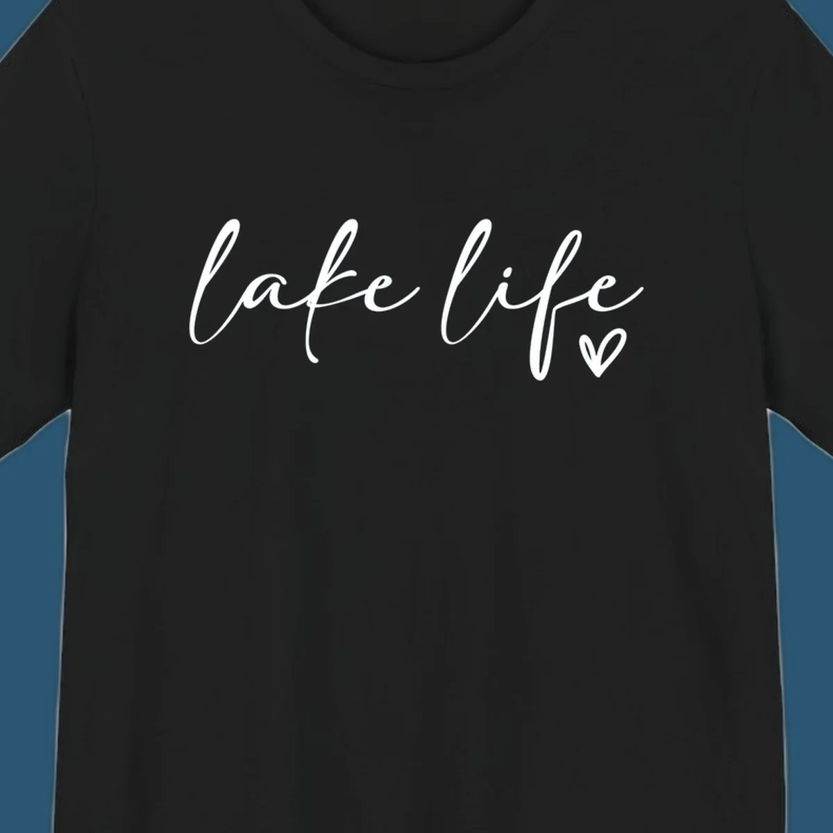 White script text reading 'lake life' with a small heart icon, on a black background.