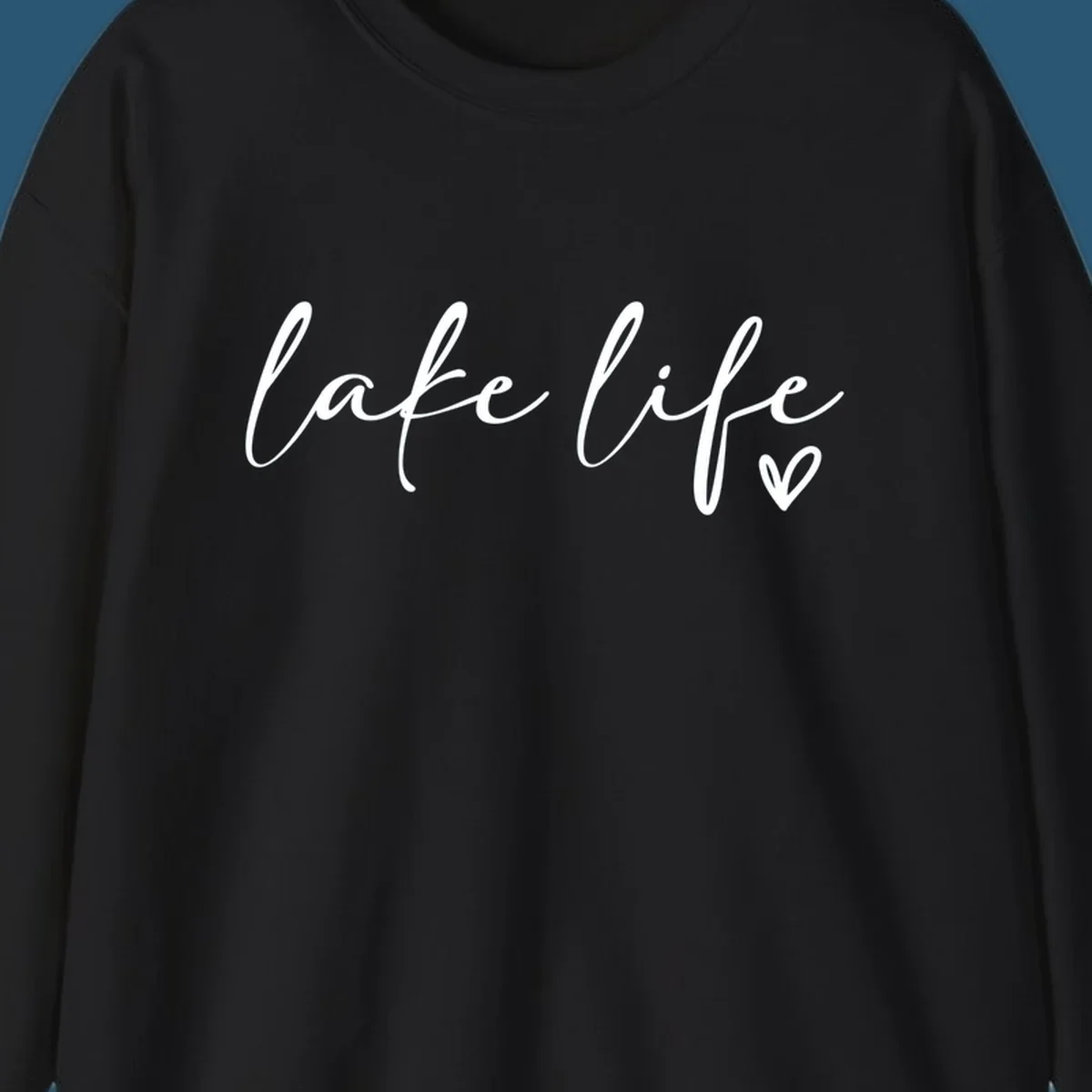 White script text reading 'lake life' with a small heart icon, on a black background.