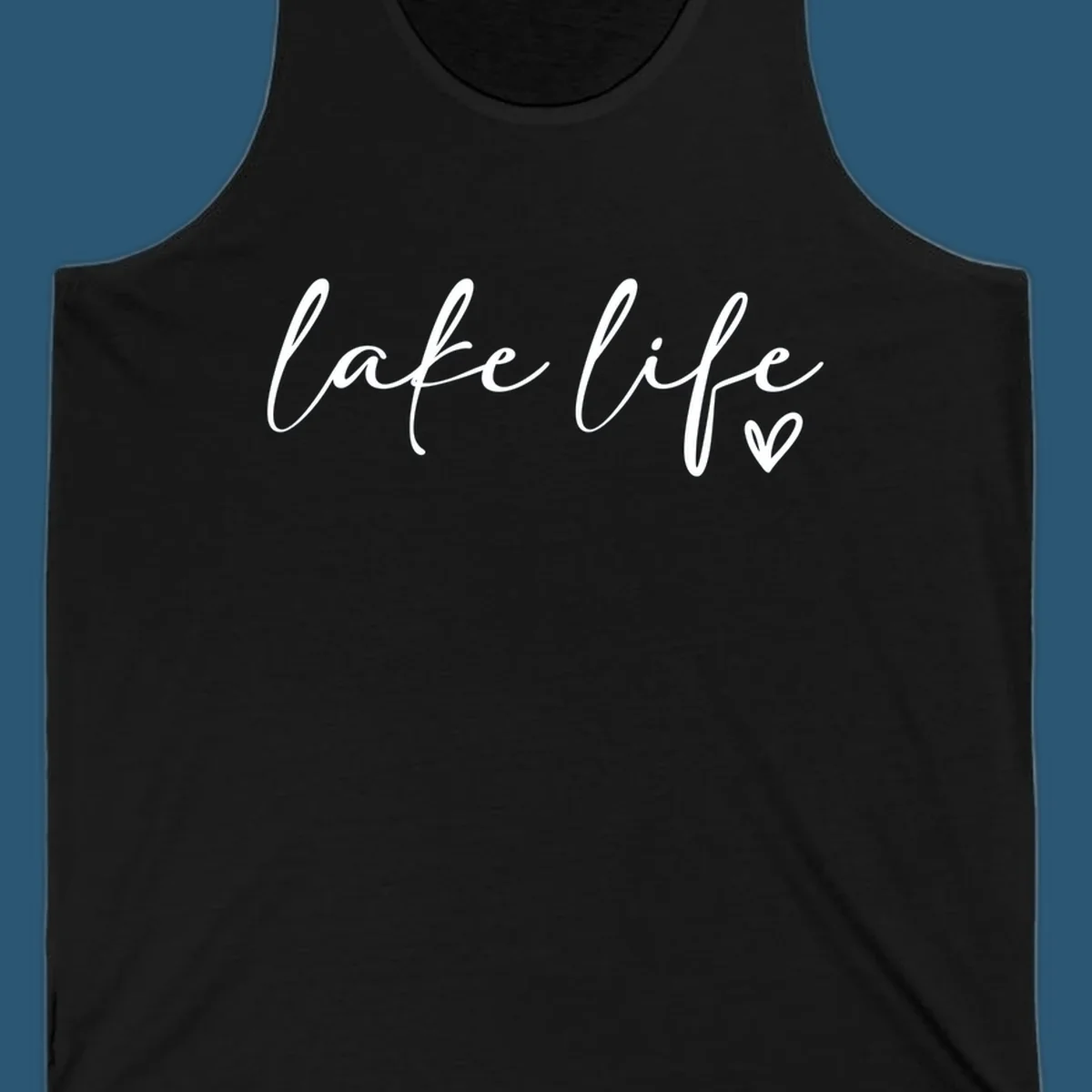 White script text reading 'lake life' with a small heart icon, on a black background.