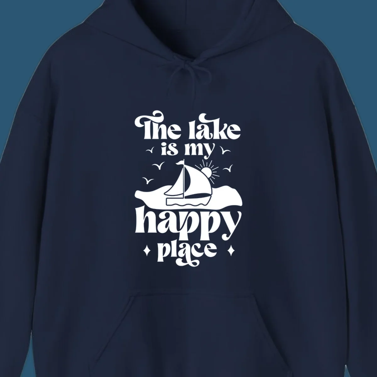 Retro text design 'The lake is my happy place' with sailboat, sun, and birds.