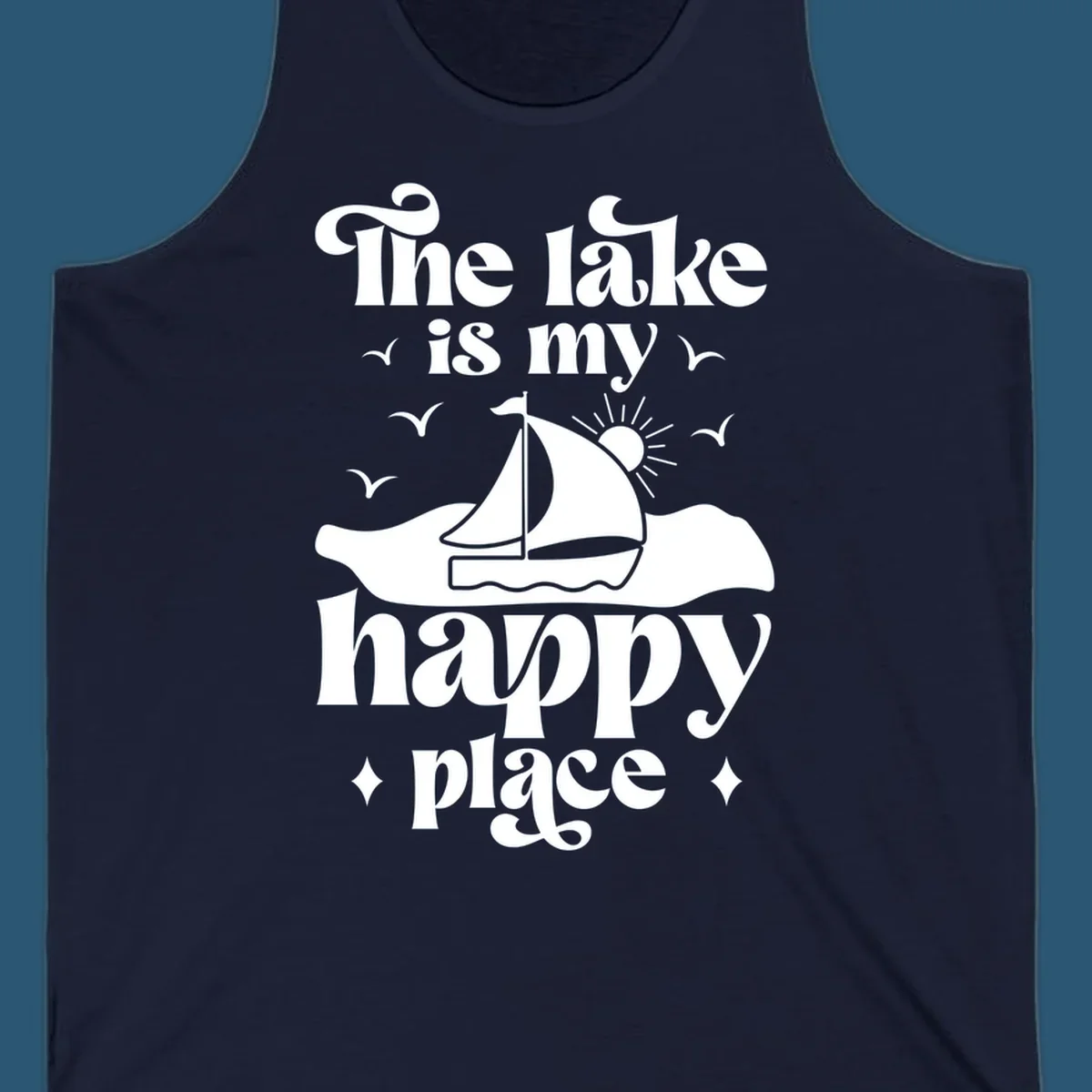 Retro text design 'The lake is my happy place' with sailboat, sun, and birds.