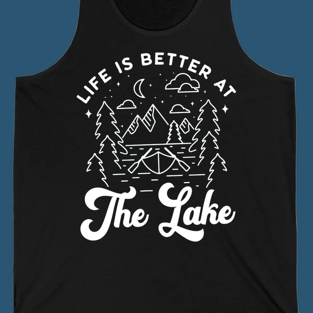 Lake life graphic with mountains, canoe, moon, and text 'Life Is Better At The Lake'.