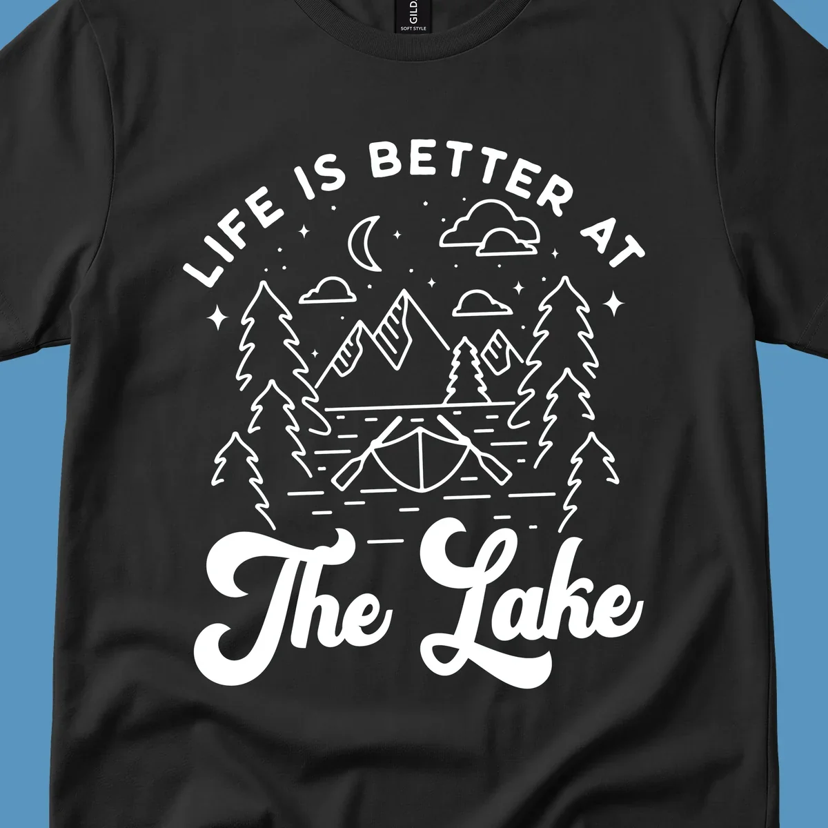 Lake life graphic with mountains, canoe, moon, and text 'Life Is Better At The Lake'.
