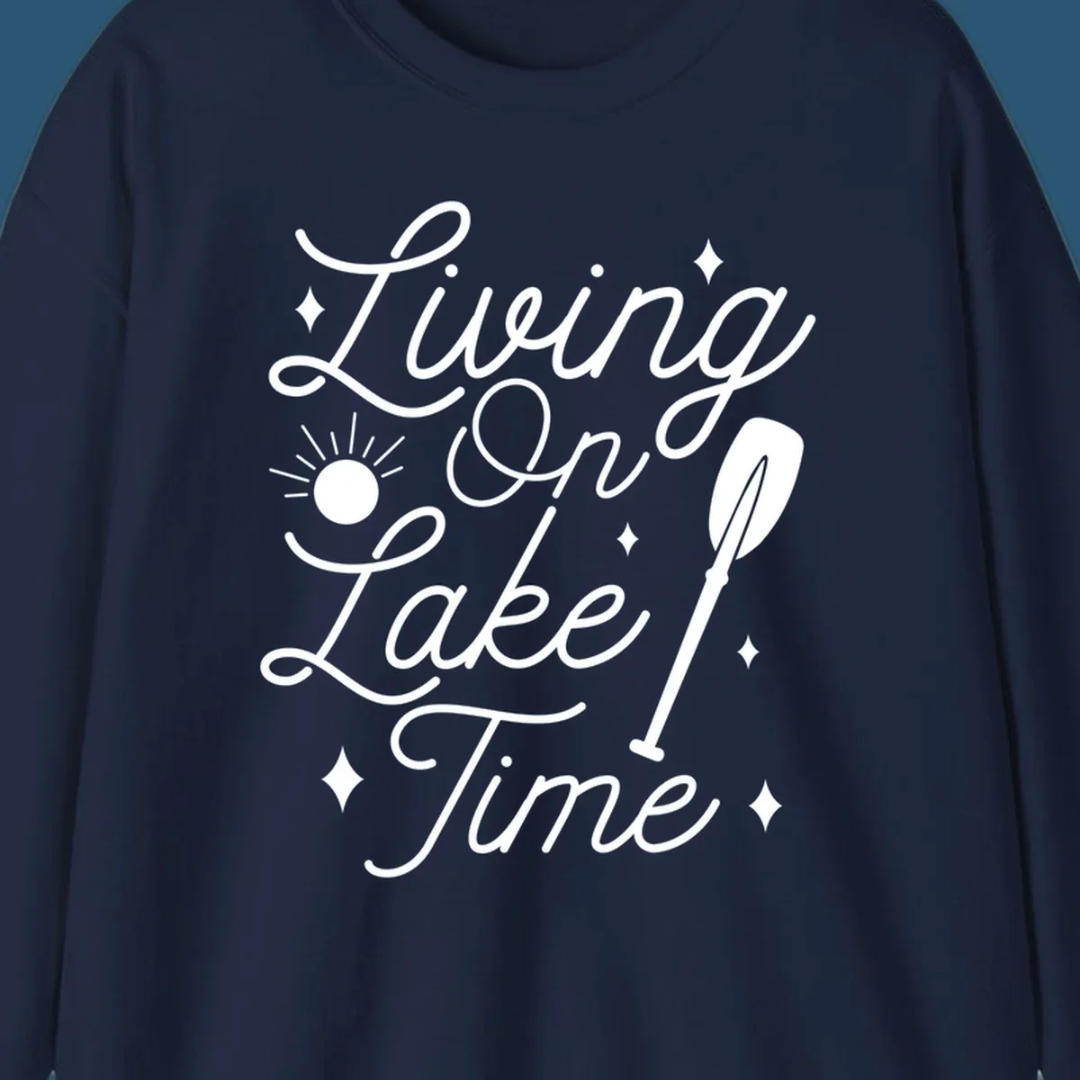 Living on lake time text with sun and paddle illustration.