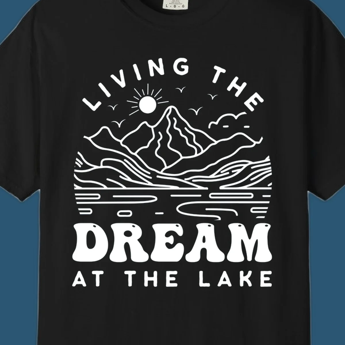 Living the dream at the lake scenic mountain landscape with sun and birds artwork.