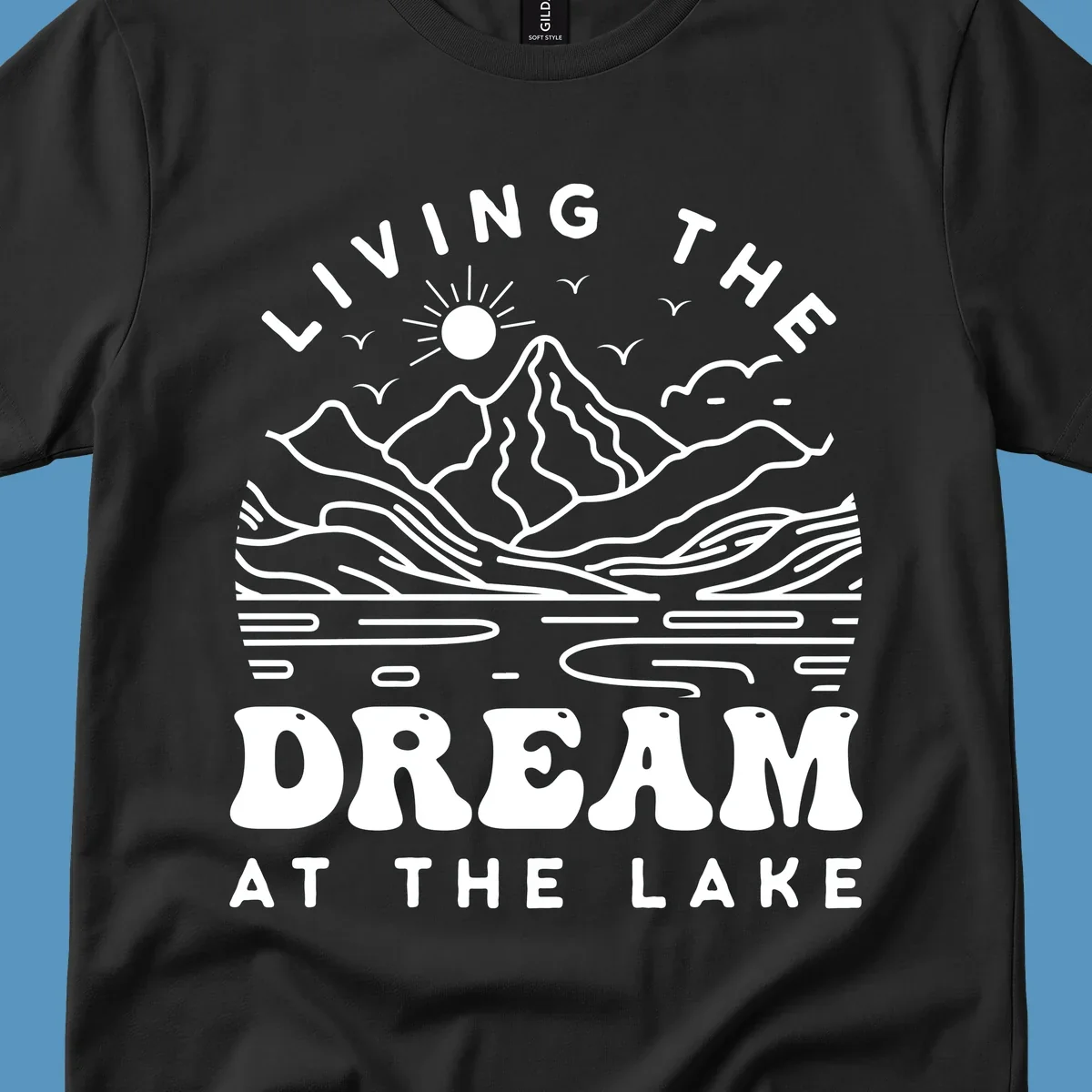 Living the dream at the lake scenic mountain landscape with sun and birds artwork.