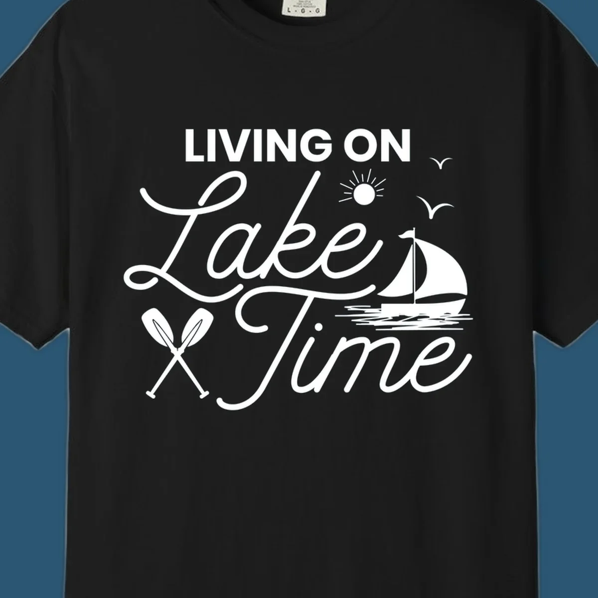 Living on lake time text with sailboat, sun, birds, and oars.