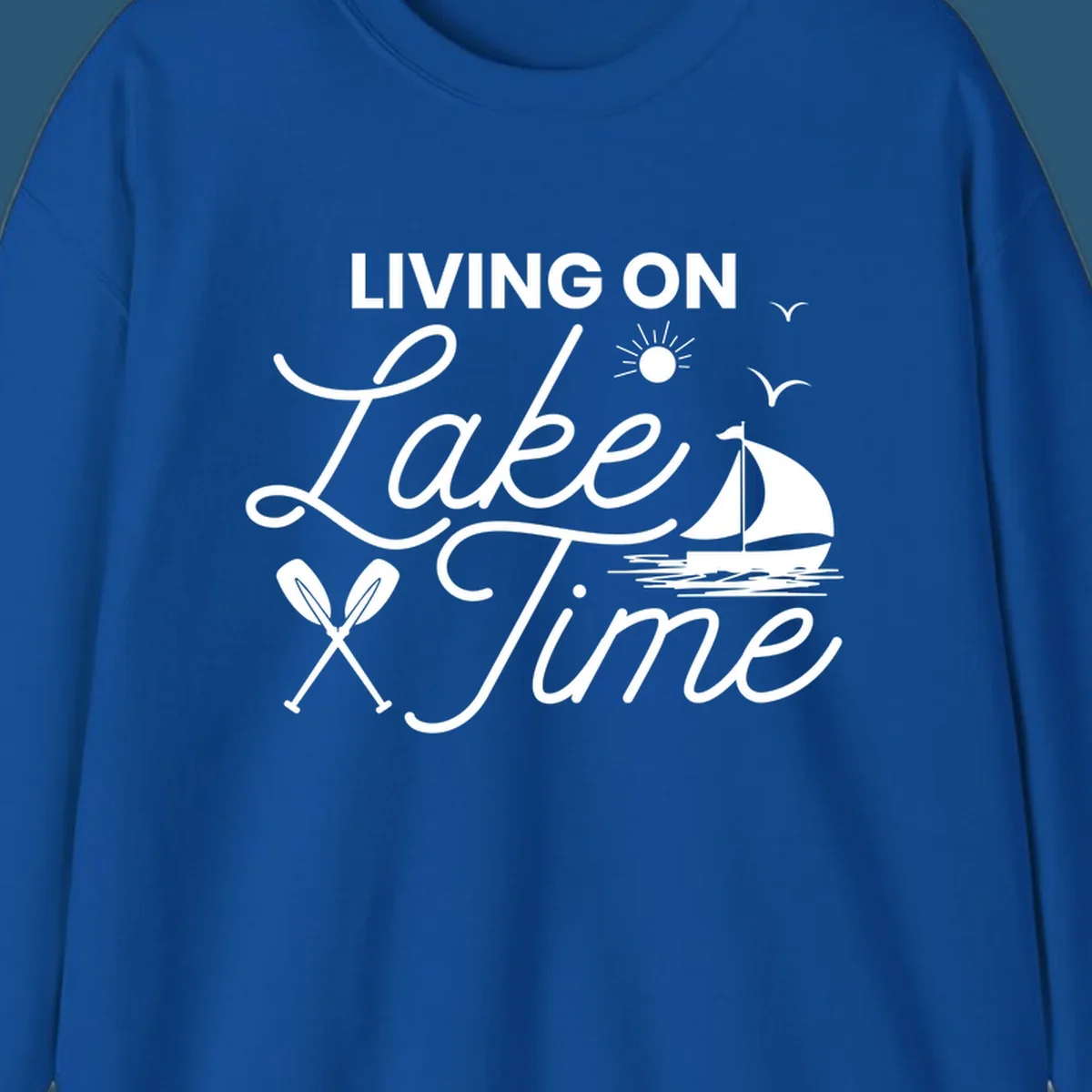 Living on lake time text with sailboat, sun, birds, and oars.