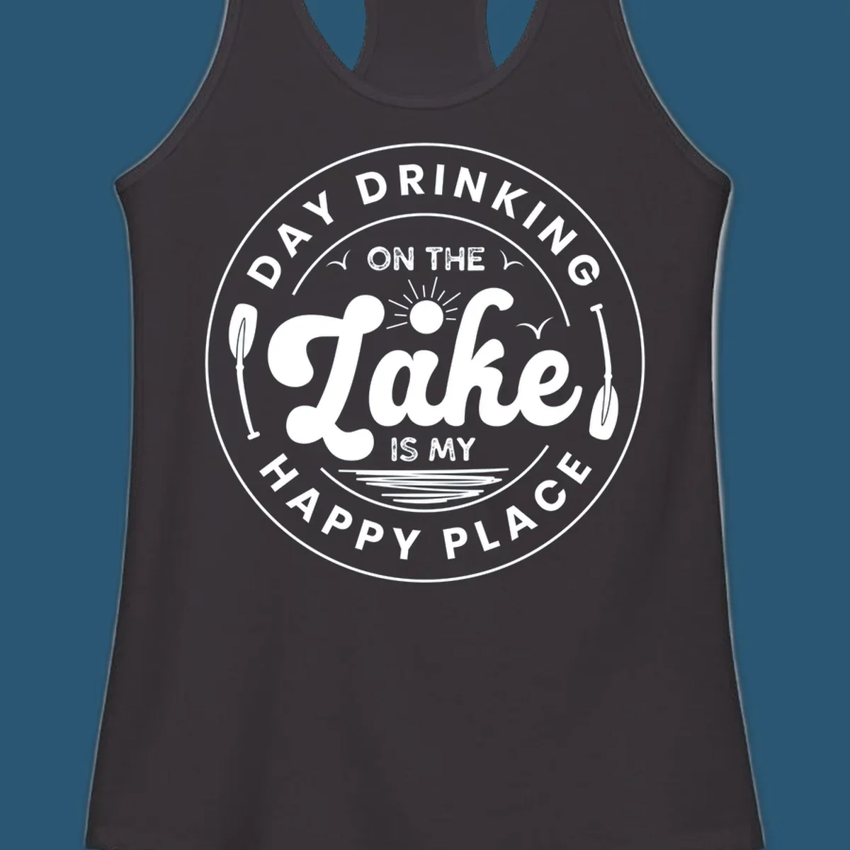 Circular badge design with text 'Day Drinking On The Lake Is My Happy Place' and lake-themed graphics.