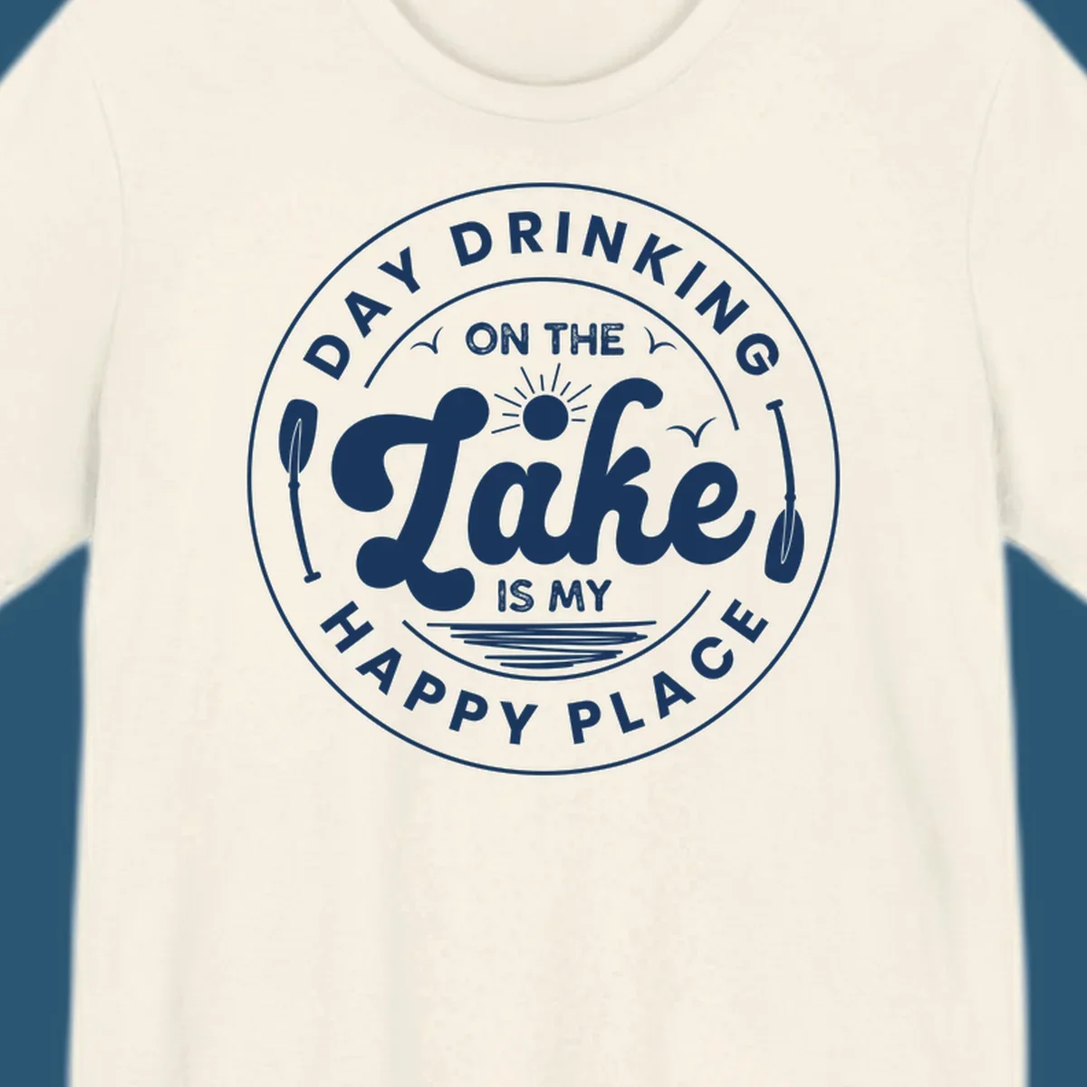 Circular badge design with text 'Day Drinking On The Lake Is My Happy Place' and lake-themed graphics.