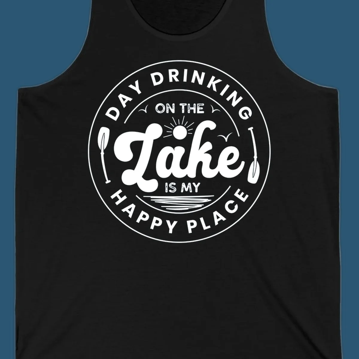 Circular badge design with text 'Day Drinking On The Lake Is My Happy Place' and lake-themed graphics.