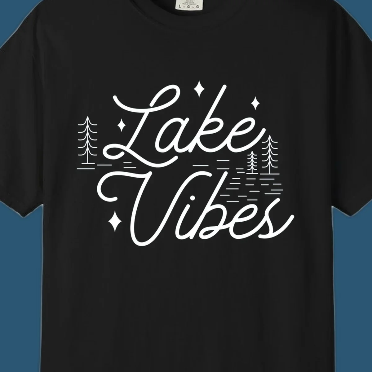 Lake Vibes text with pine trees and stars, nature-inspired lake graphic.